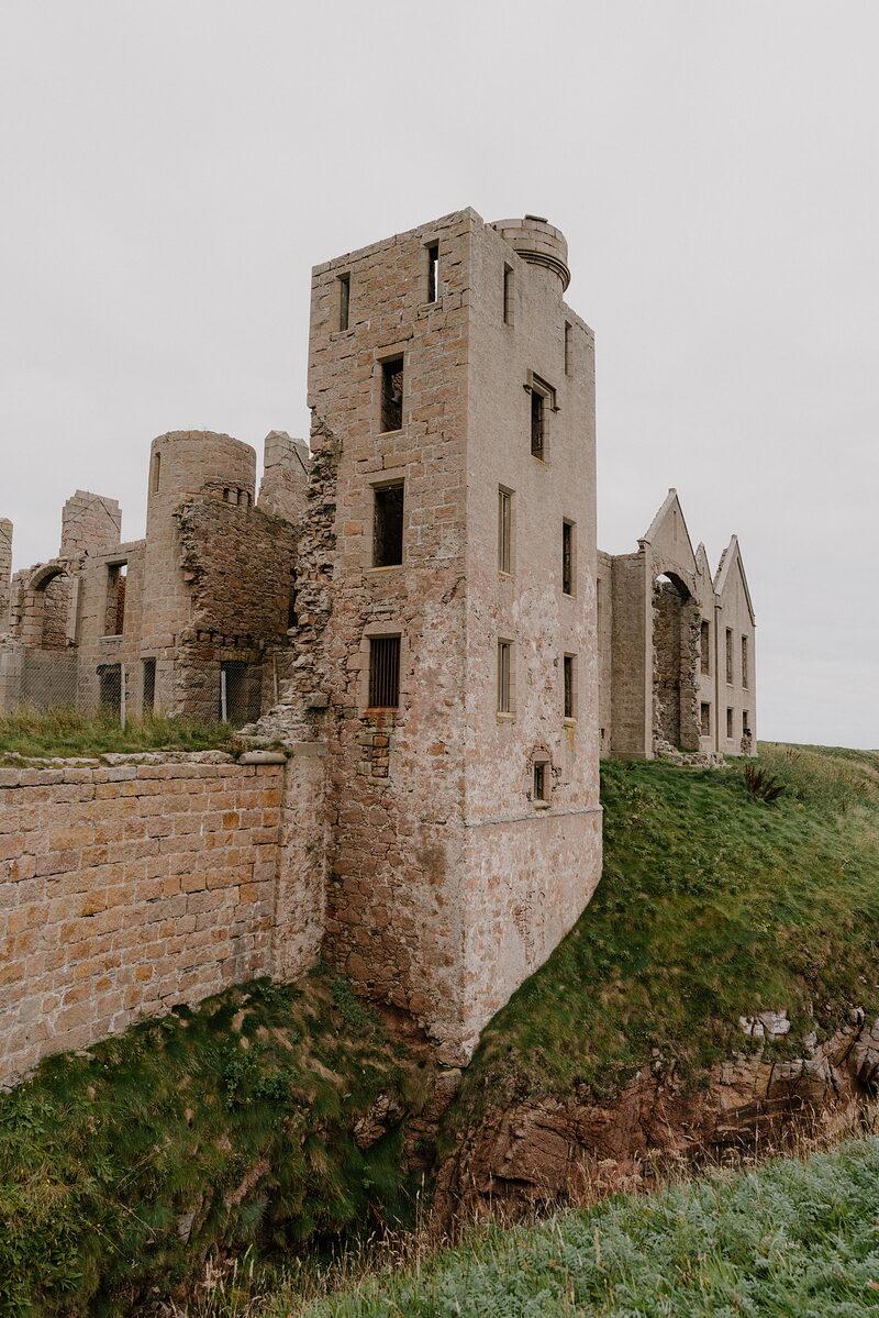 A ruined castle standing on a clifftop above the sea in Aberdeenshire.