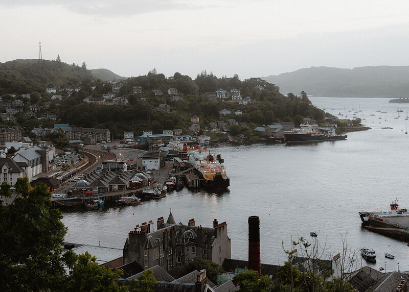 Oban curves round its harbour below the hill, ferries at the pier and yachts in the north of the bay.