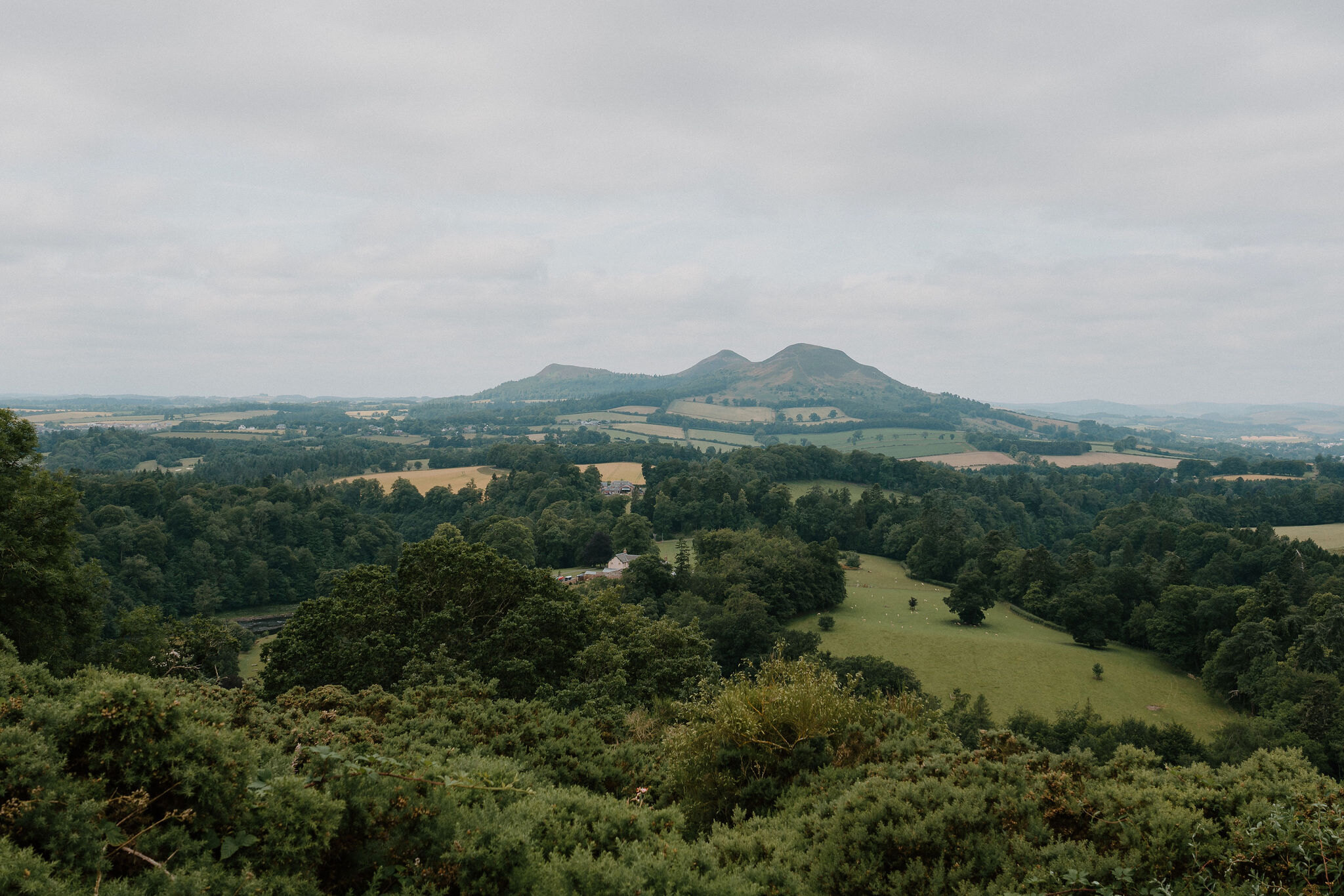 The three tops of the Eildon Hills over the farmland of the Tweed valley, from Scott's View.