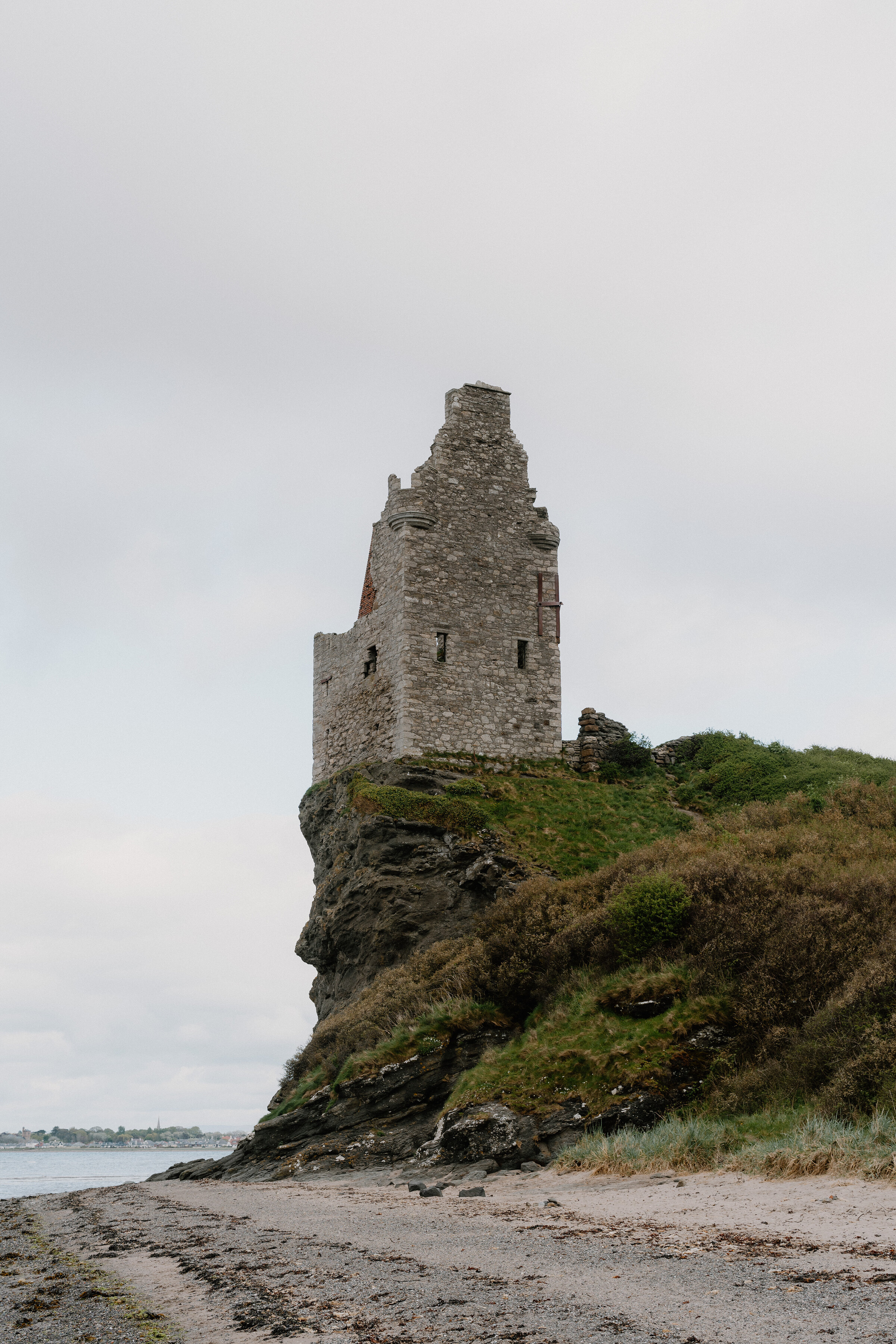 Greenan Castle on its clifftop above the beach south of Ayr.