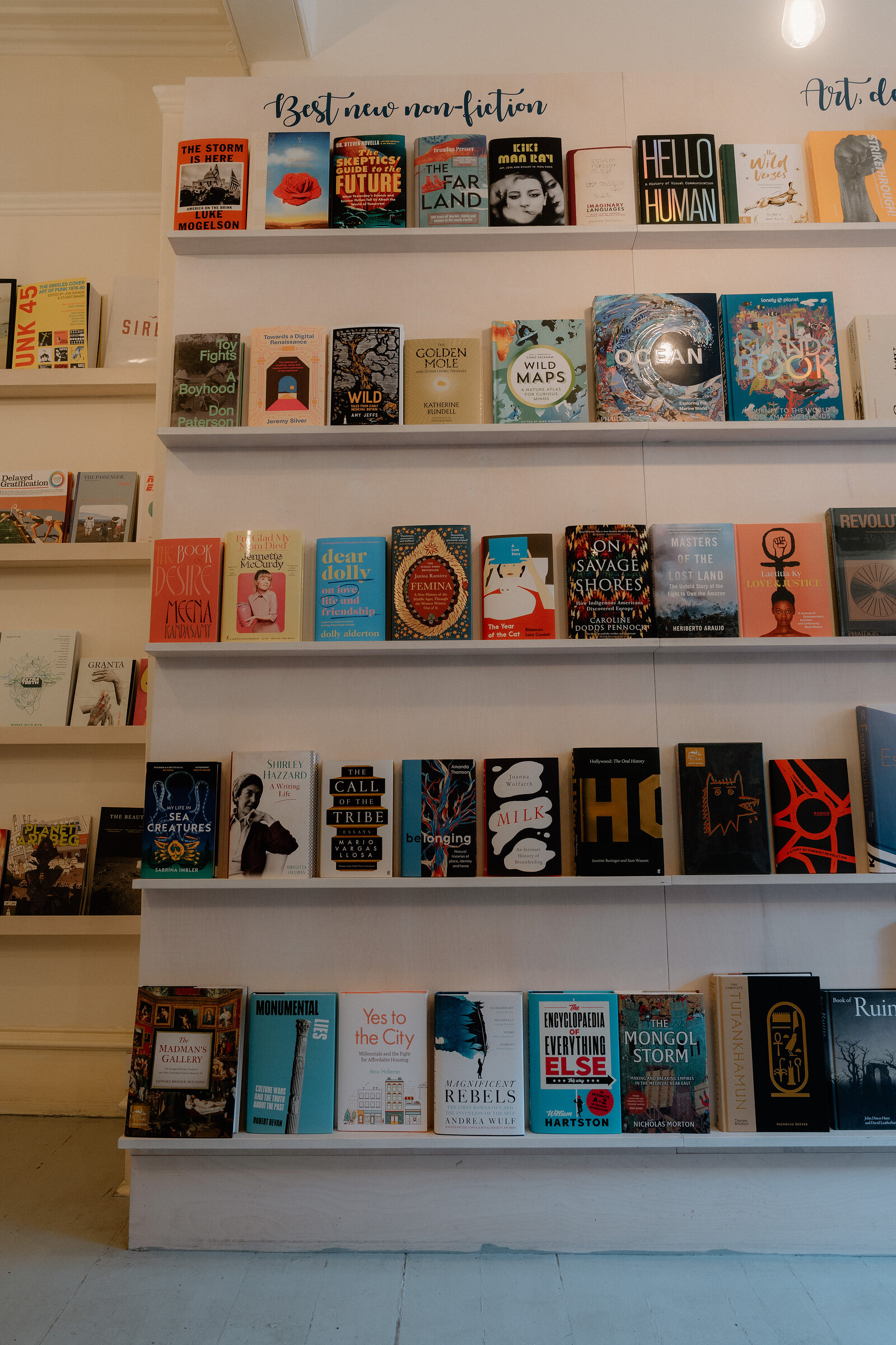 Shelves labelled 'Best new non-fiction' hold rows of colourful book covers at Golden Hare Books.