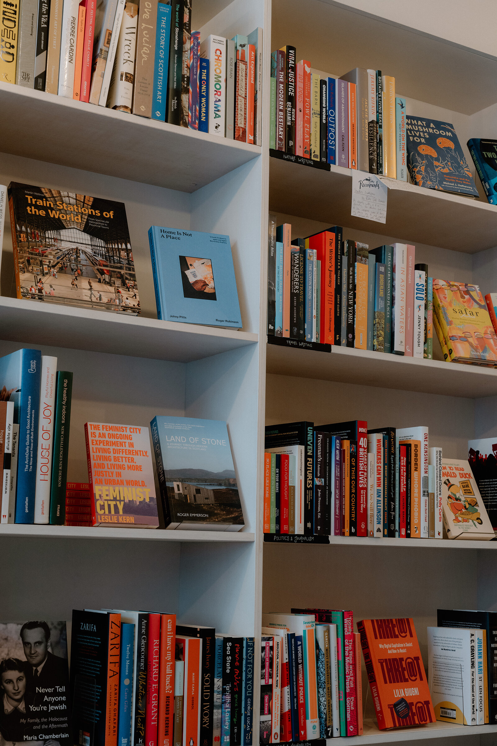 Floor-to-ceiling shelving holds rows of paperbacks at Golden Hare Books.
