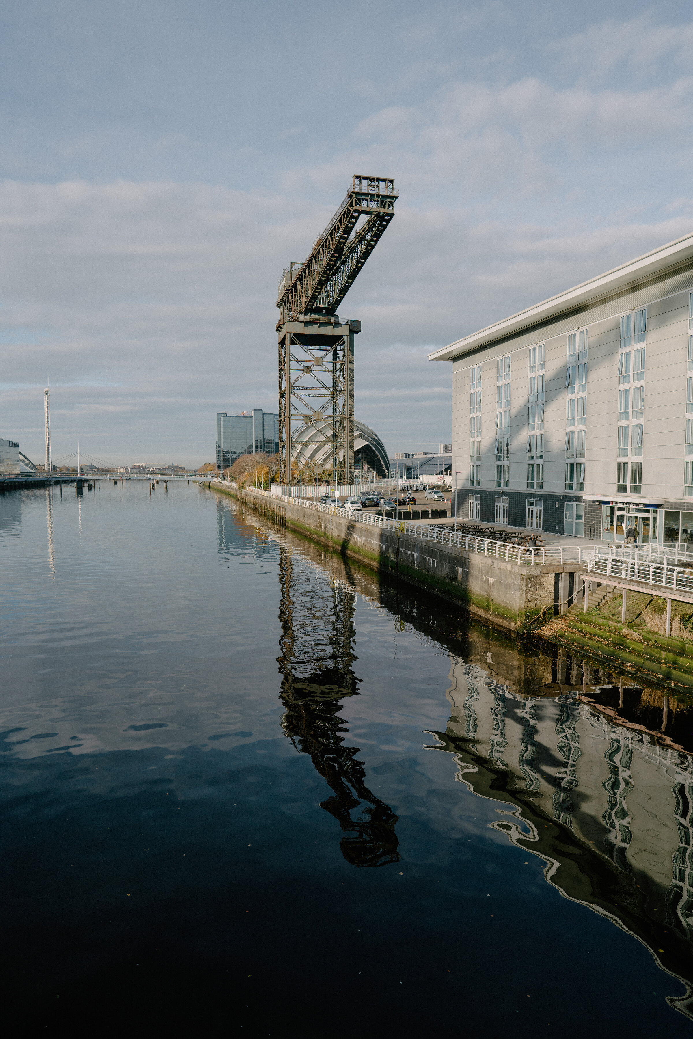 The Finnieston Crane reflected in the Clyde on a calm day.