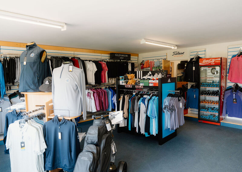 Golf clothing on rails inside the professional’s shop.