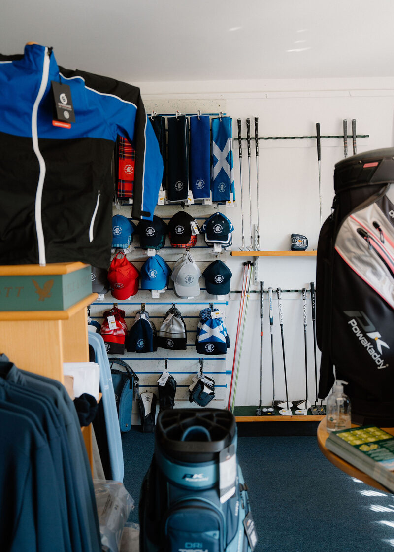 Caps with the club crest, saltire bags and clubs in the professional’s shop.