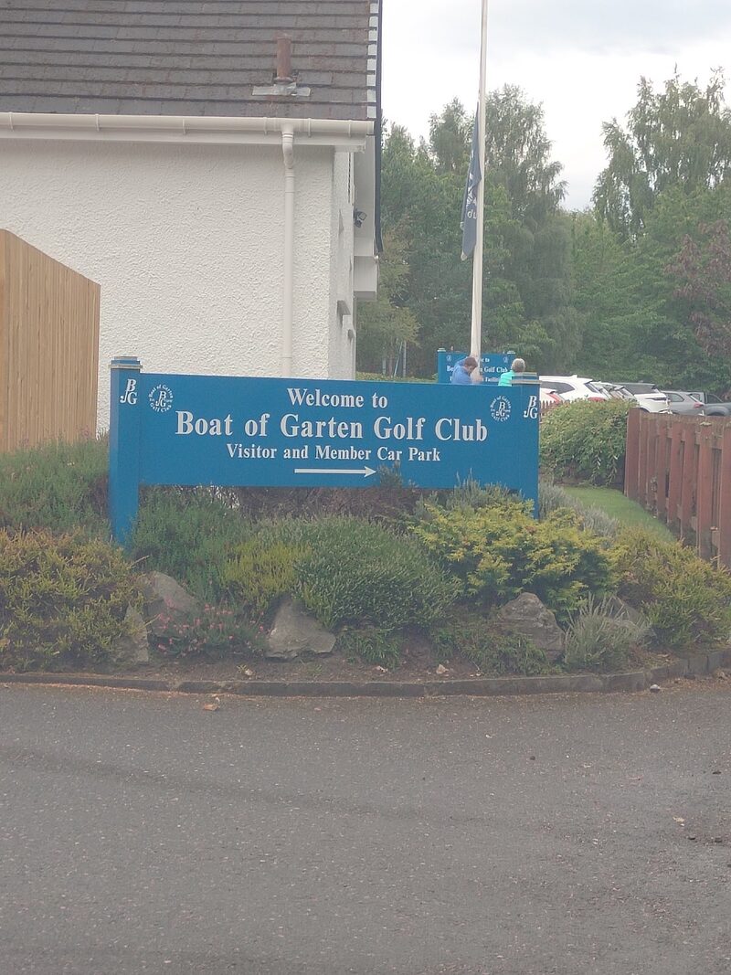 The blue sign at the entrance: Welcome to Boat of Garten Golf Club, Visitor and Member Car Park, with the club crest.