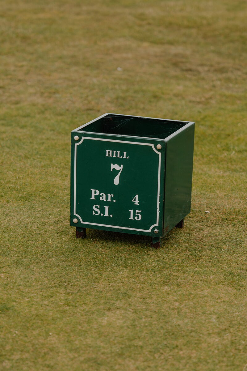 A green marker box reading Hill, hole 7, par 4, stroke index 15, set on the fairway