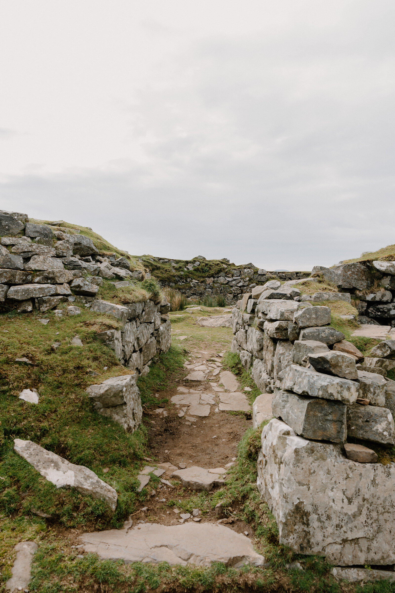 A stone passage runs through the ruined walls of a fortification on the Isle of Skye.