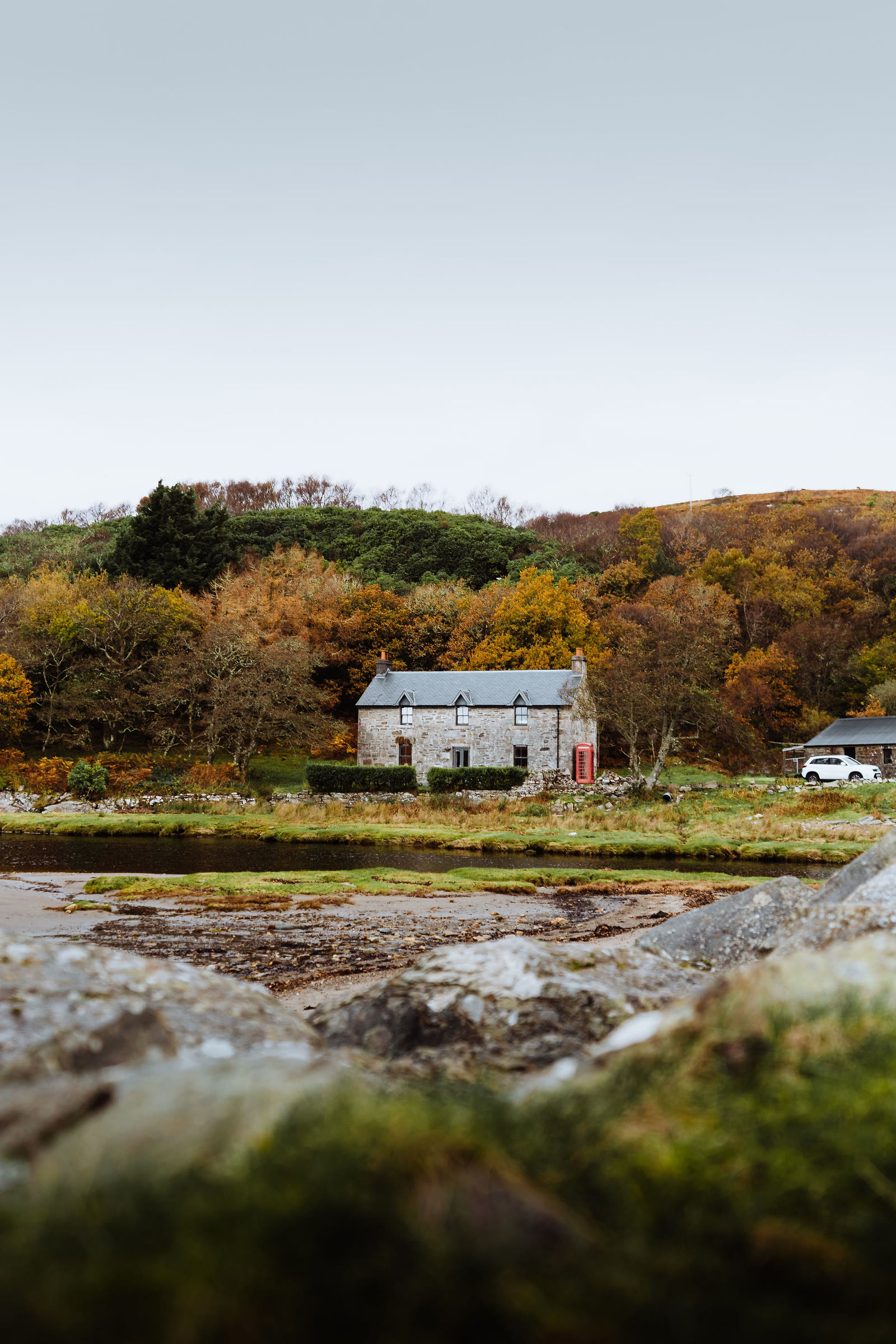 The cottage at Inverlussa across the rocks.
