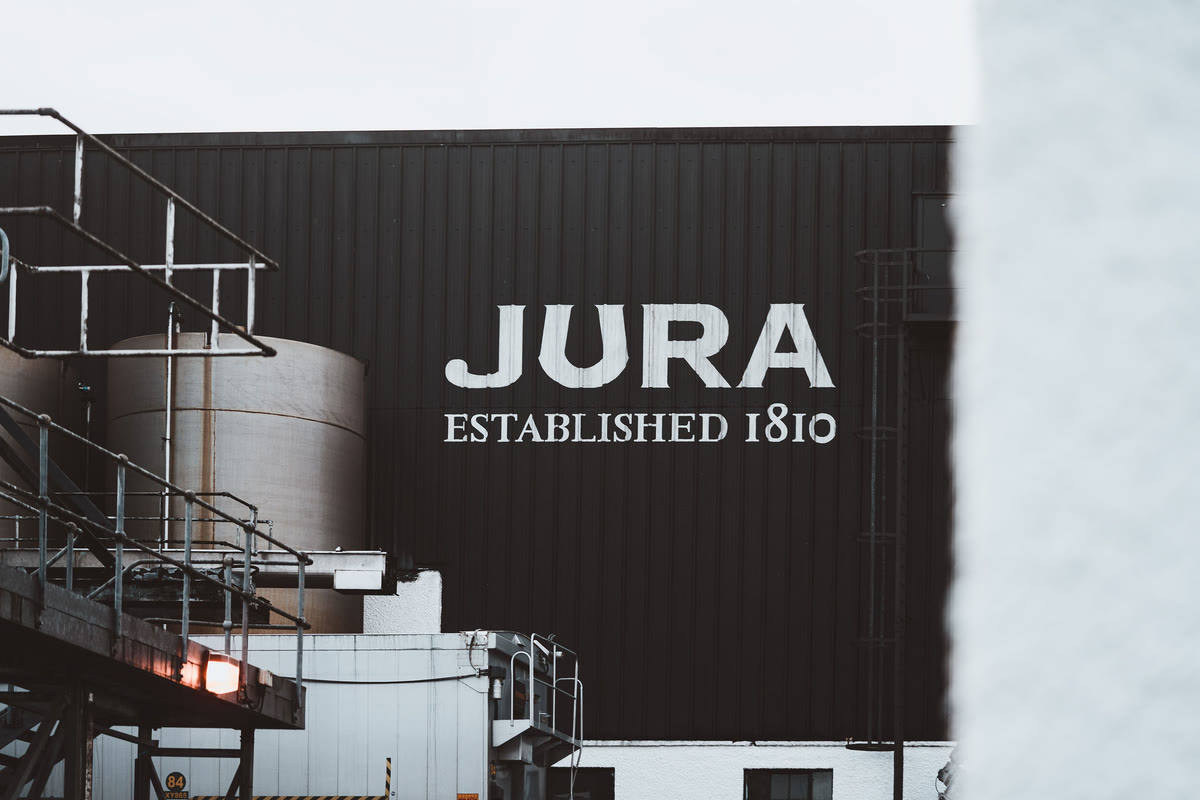 Jura Established 1810 on the dark wall of the distillery.