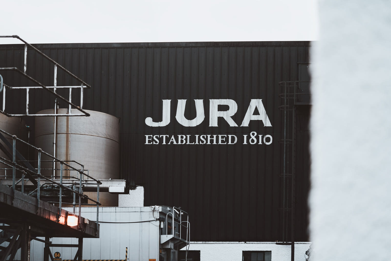 Jura Established 1810 on the dark wall of the distillery.