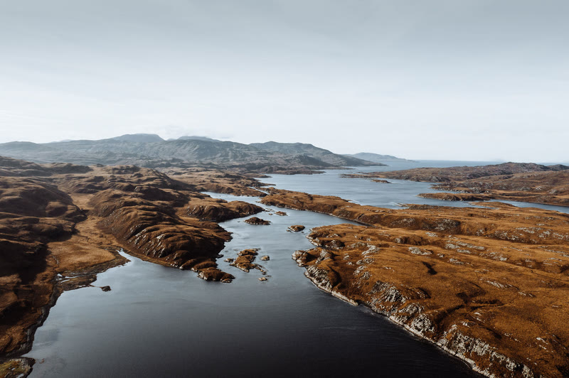 The narrows of Loch Tarbert between rocky moorland, from the air.