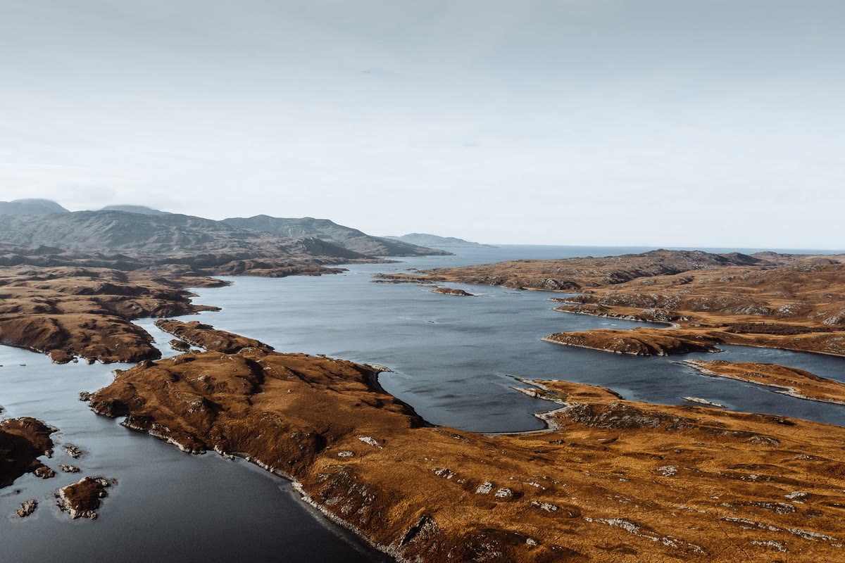 Loch Tarbert opening towards the sea, hills beyond.