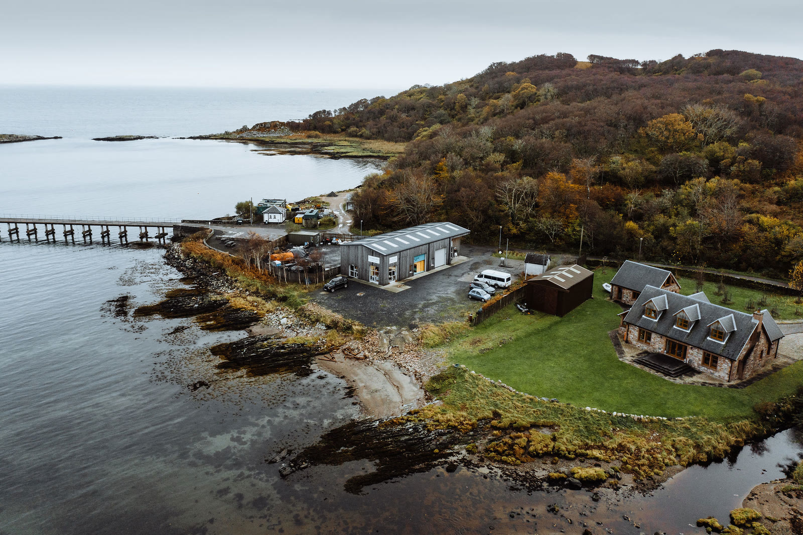The Pier Garage buildings above the shore at Craighouse, from the air.