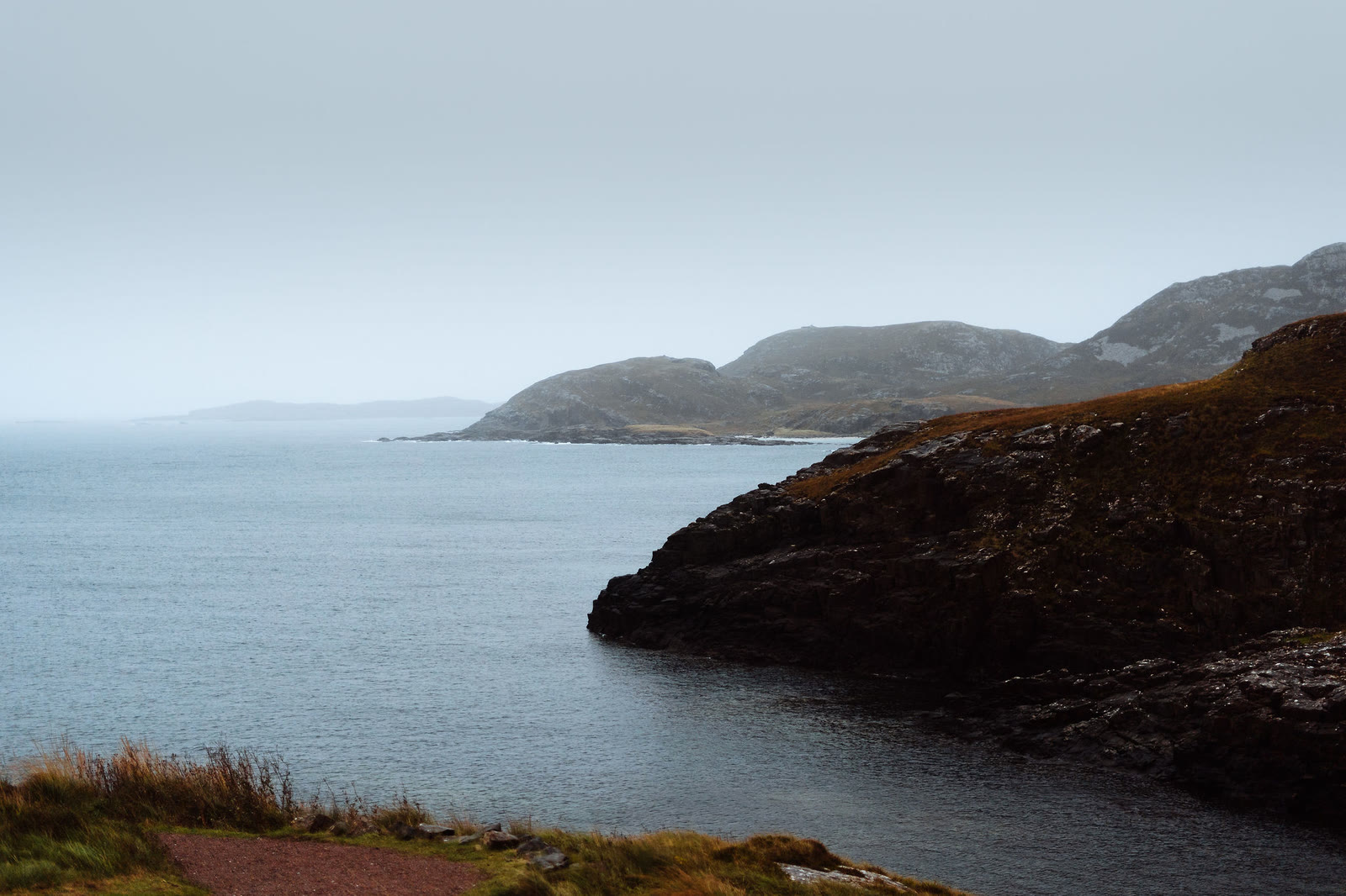 The rocky coast at Ardnamurchan Point under low cloud.