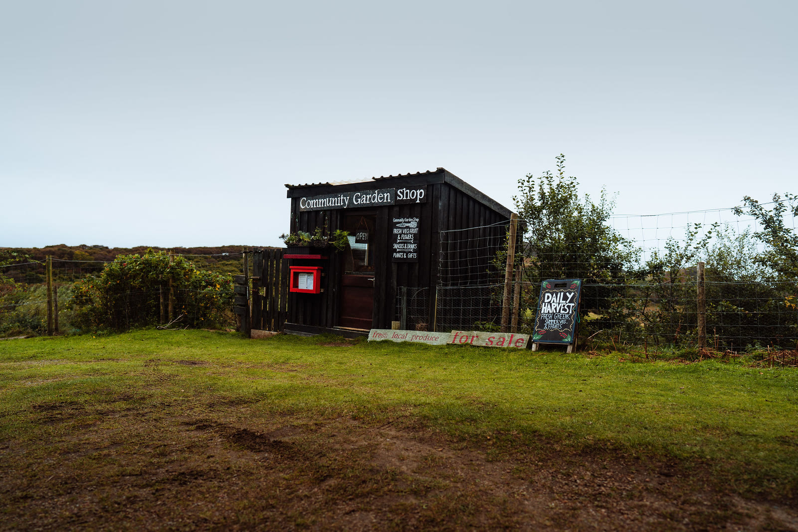 The black wooden Community Garden Shop at Kilchoan on Ardnamurchan.