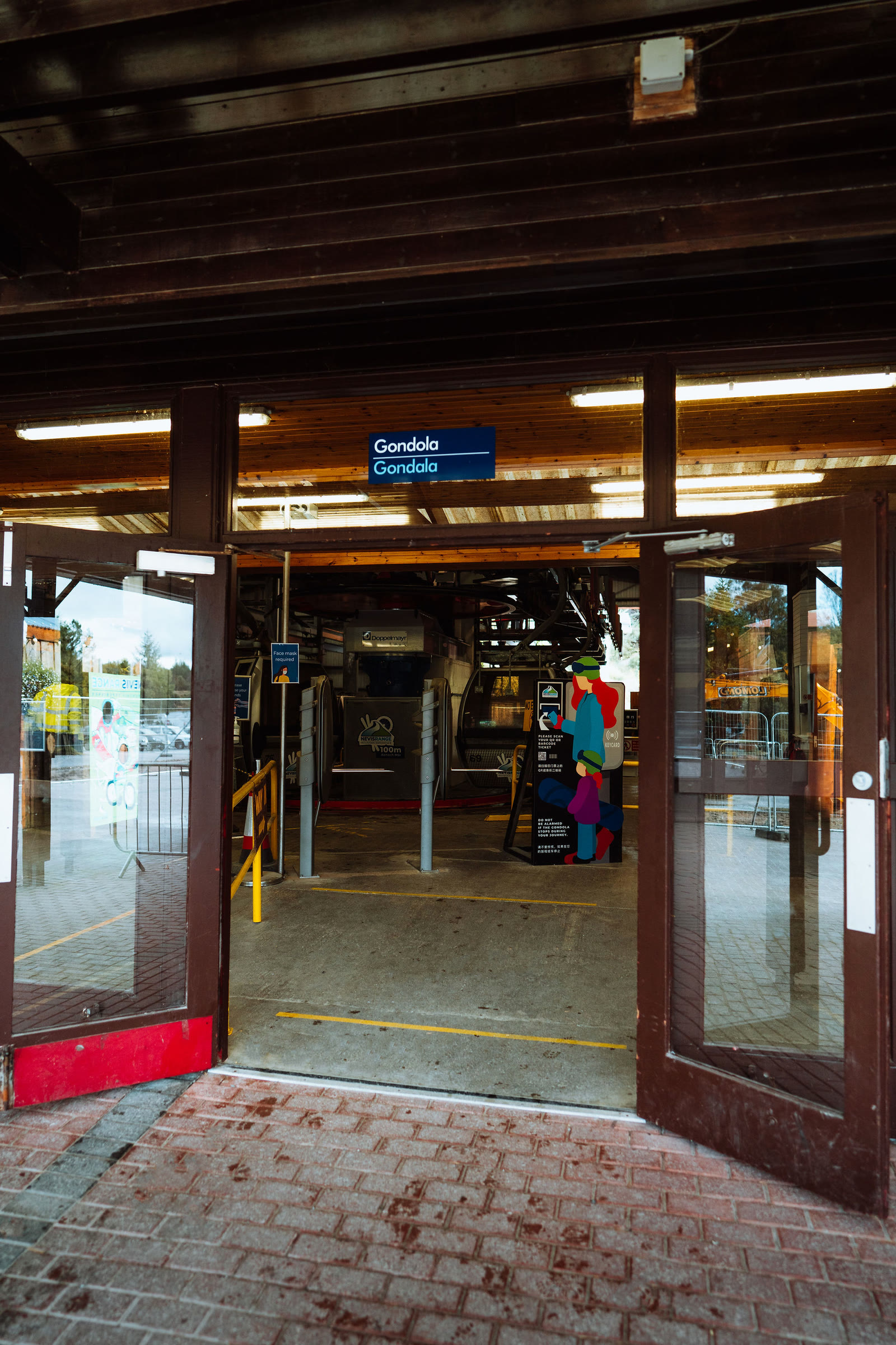 The doors of the gondola station at Nevis Range, the cars turning inside.