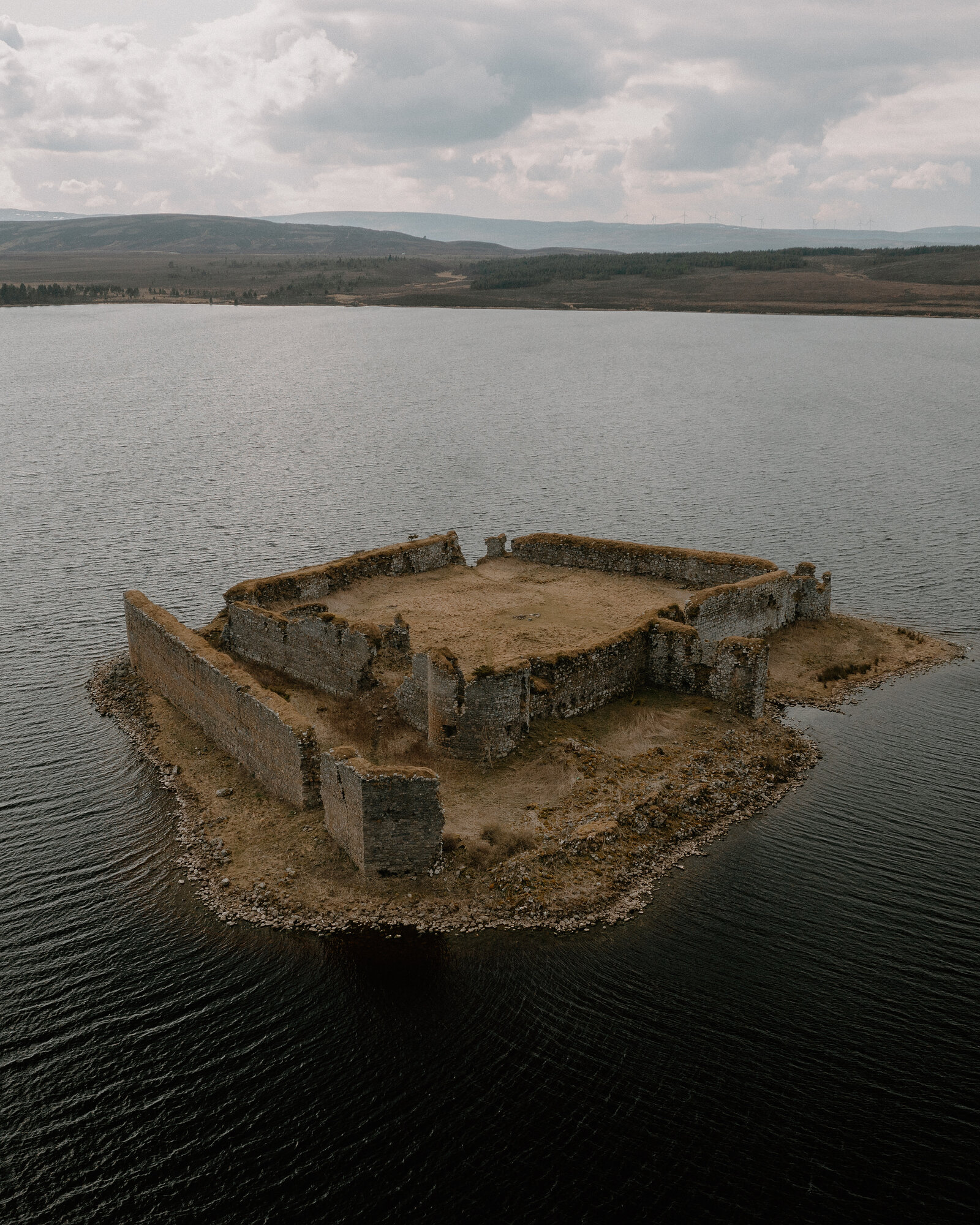 Lochindorb Castle's island ruins are seen directly from above, Moray.