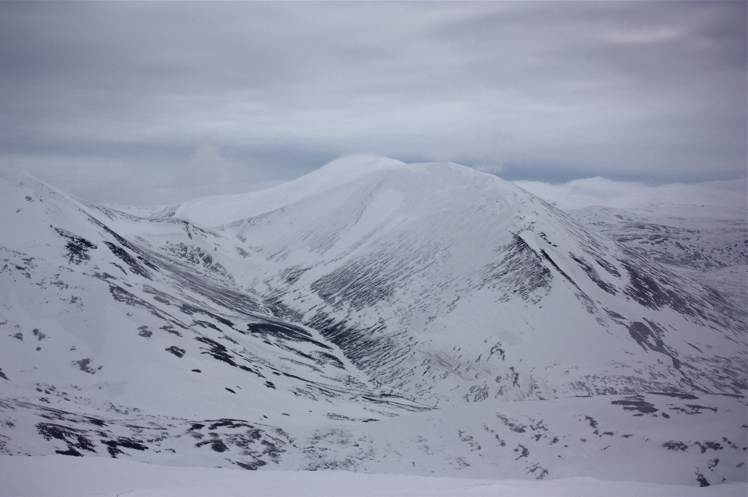 Càrn nan Gabhar under full winter snow.