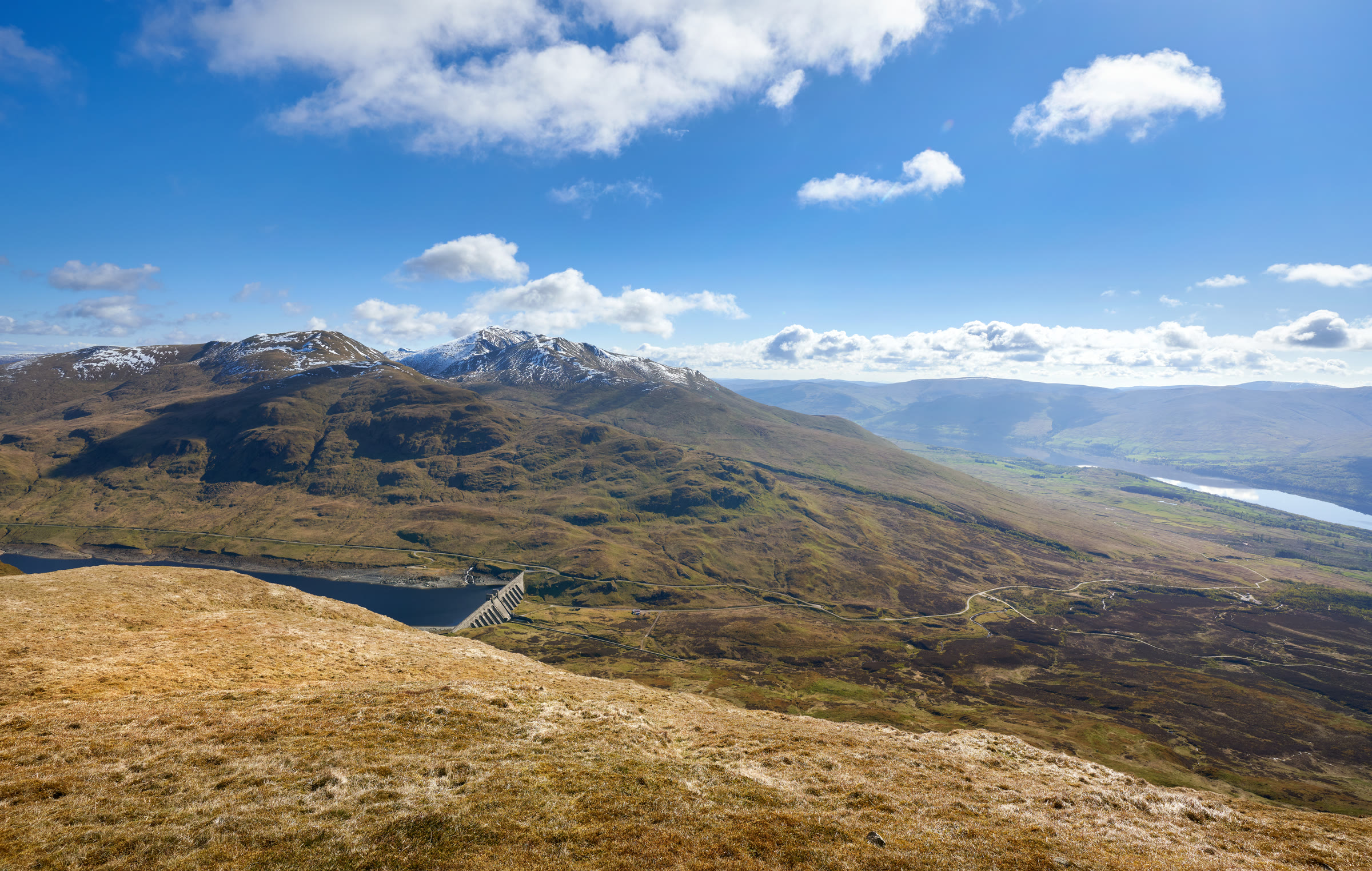 Ben Lawers and Meall Corranaich with snow on their tops above Lochan na Lairige, from Meall nan Tarmachan.