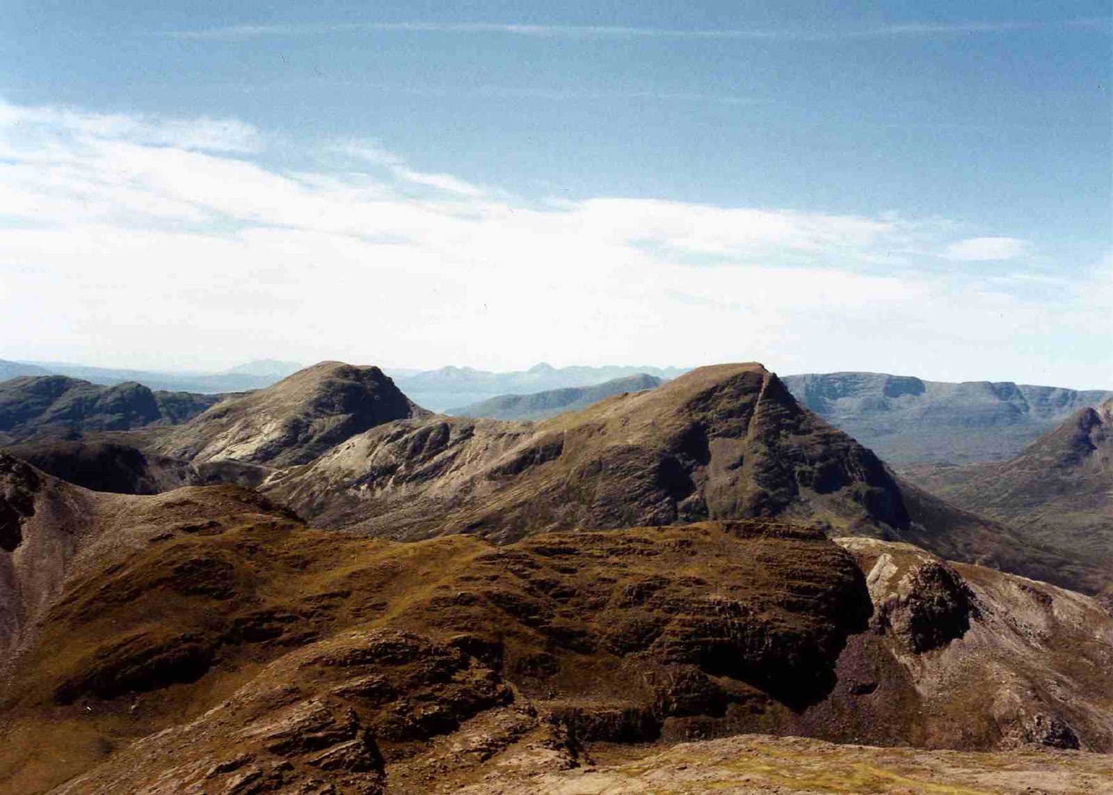 Maol Chean-dearg and a second steep hill seen from Beinn Liath Mhor, with the Skye hills hazy behind.