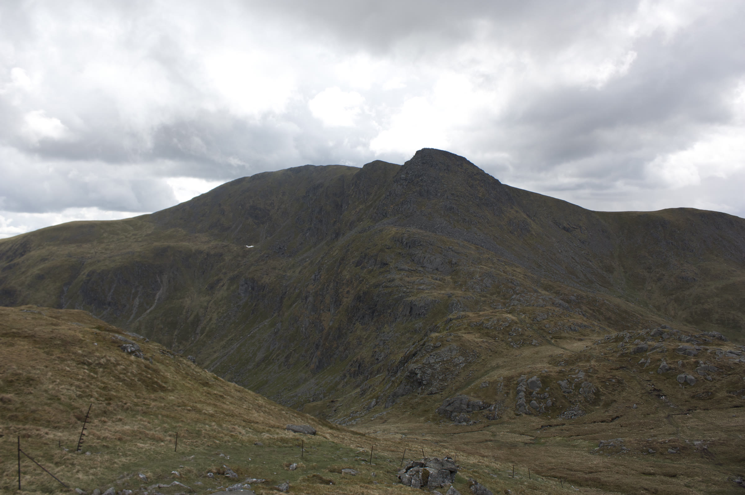Stùc a' Chròin under broken cloud, the rocky prow at the end of its ridge.