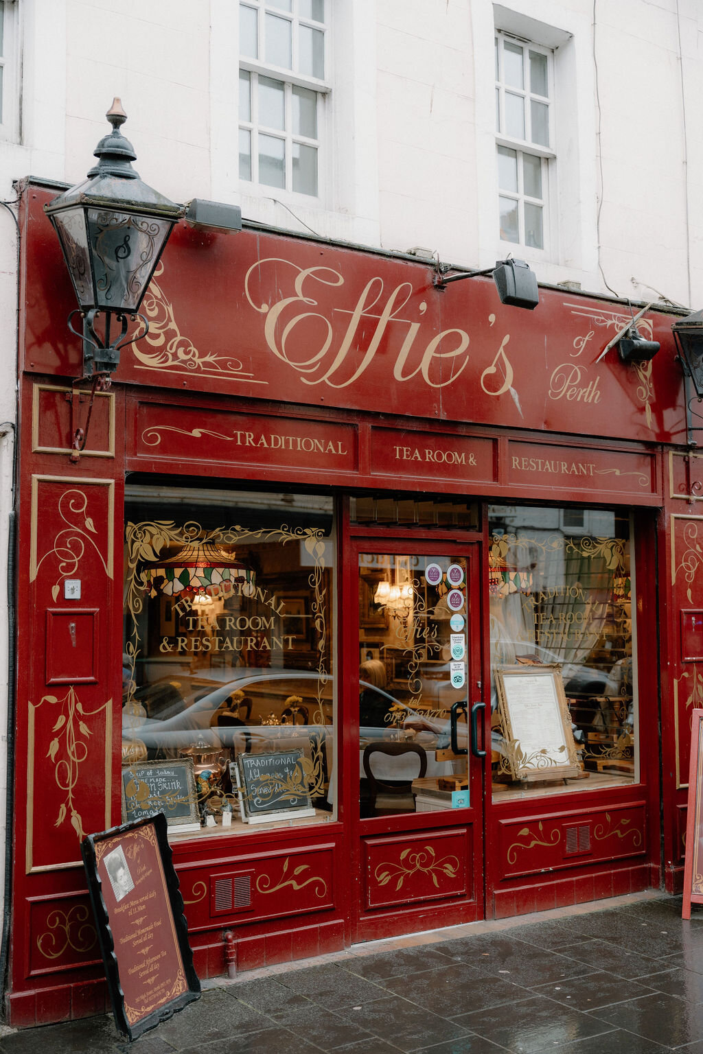 Gold lettering announces Effie's traditional tea room and restaurant on a red shopfront.