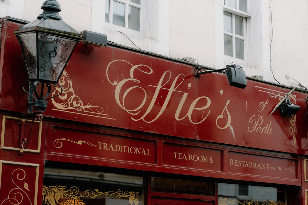 Gold lettering spells out Effie's traditional tea room above a red-painted shopfront.