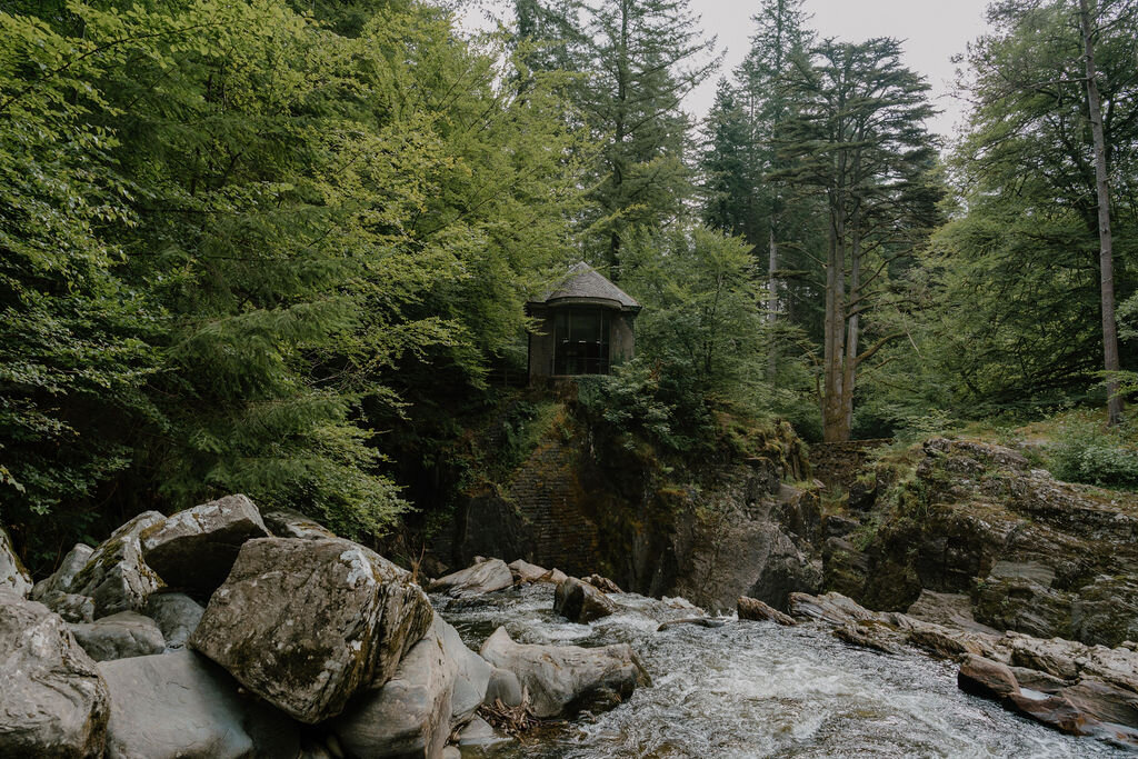 Ossian's Hall stands on a rocky outcrop above a rushing river gorge at The Hermitage, Dunkeld.