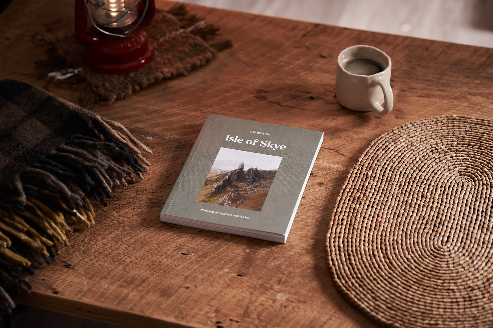 The Best of Skye on a wooden table beside a mug