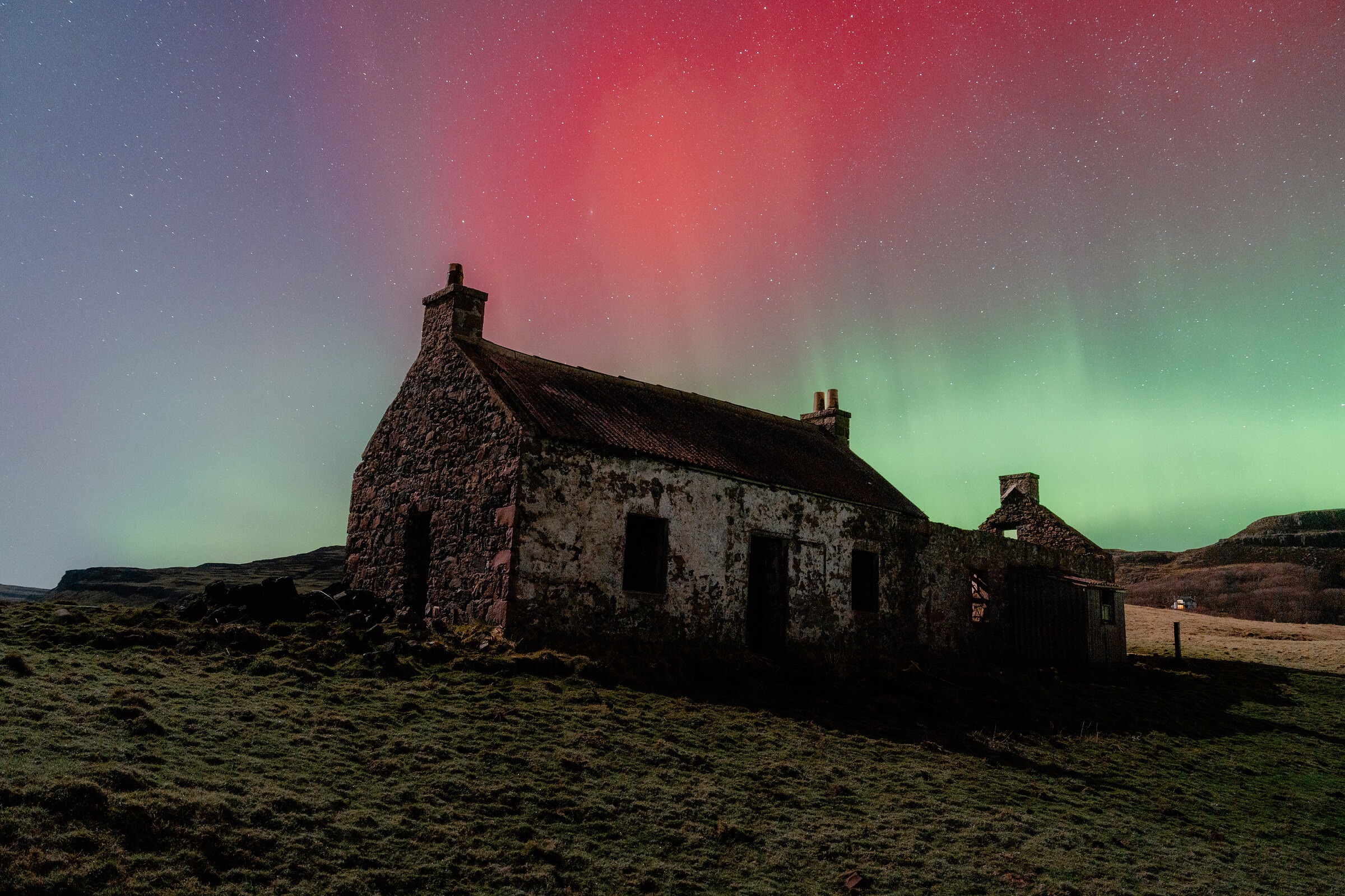 Red and green over an old cottage on Canna, in the Small Isles.