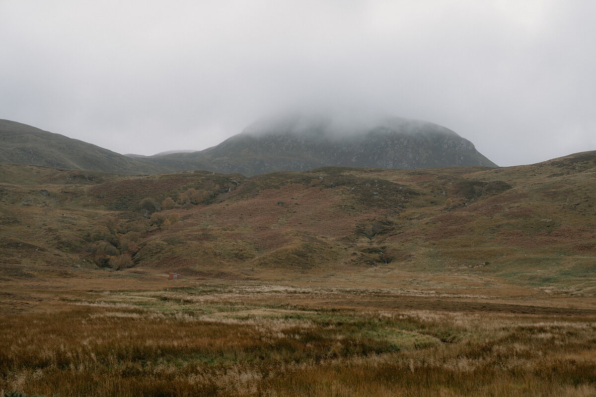 Mist settling over heather-covered hills at Lettermore, by Loch Loyal.