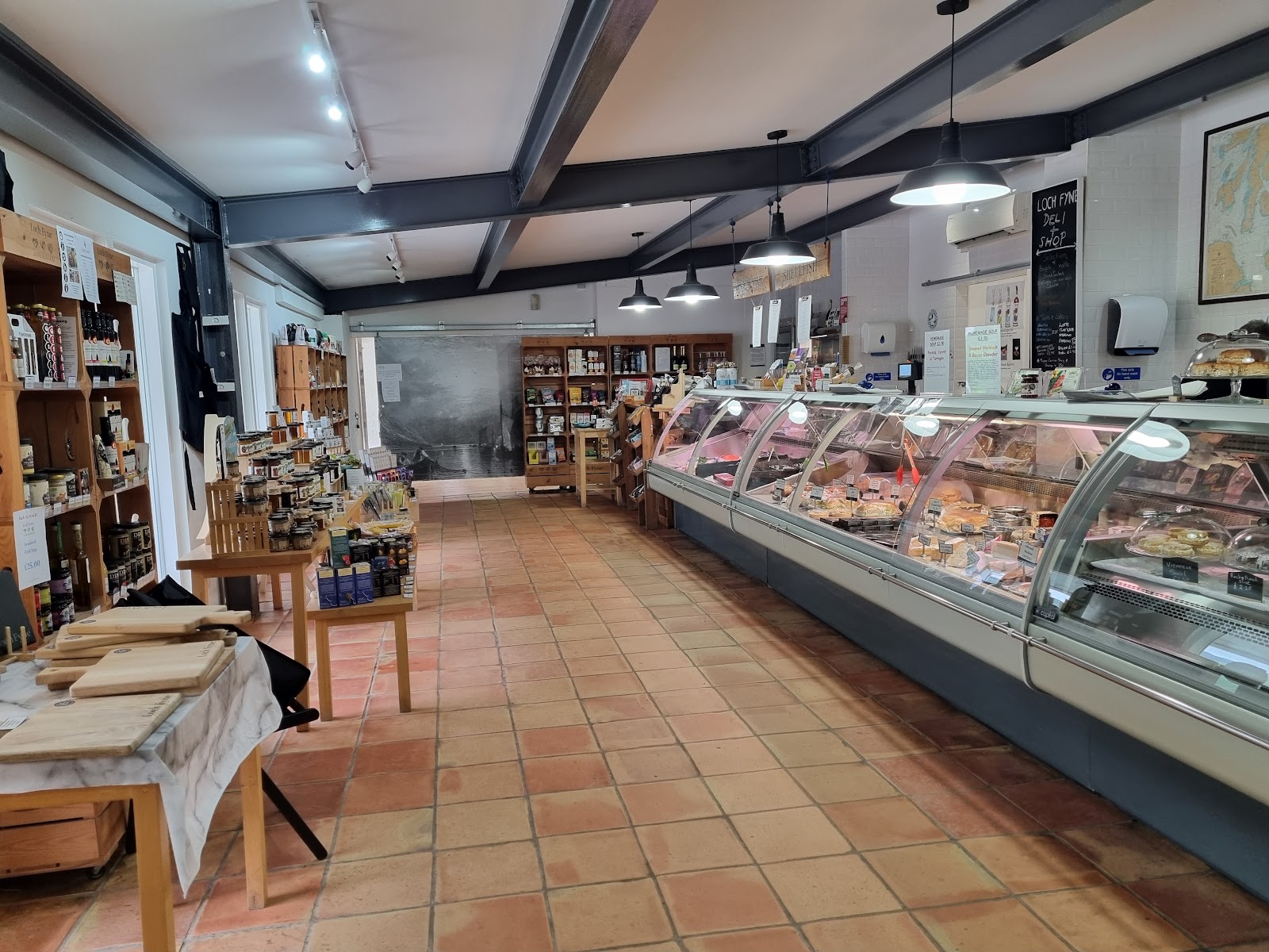 Chilled counter and shelves of jars inside the Loch Fyne Deli and Shop