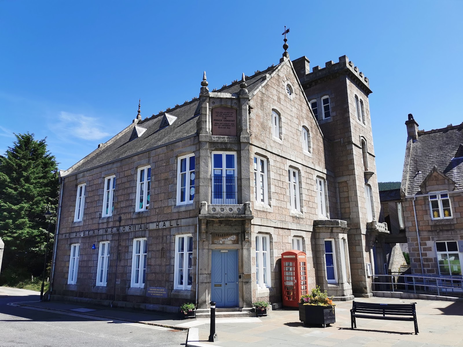 The Albert Memorial Hall, with a red telephone box outside its turreted stone facade