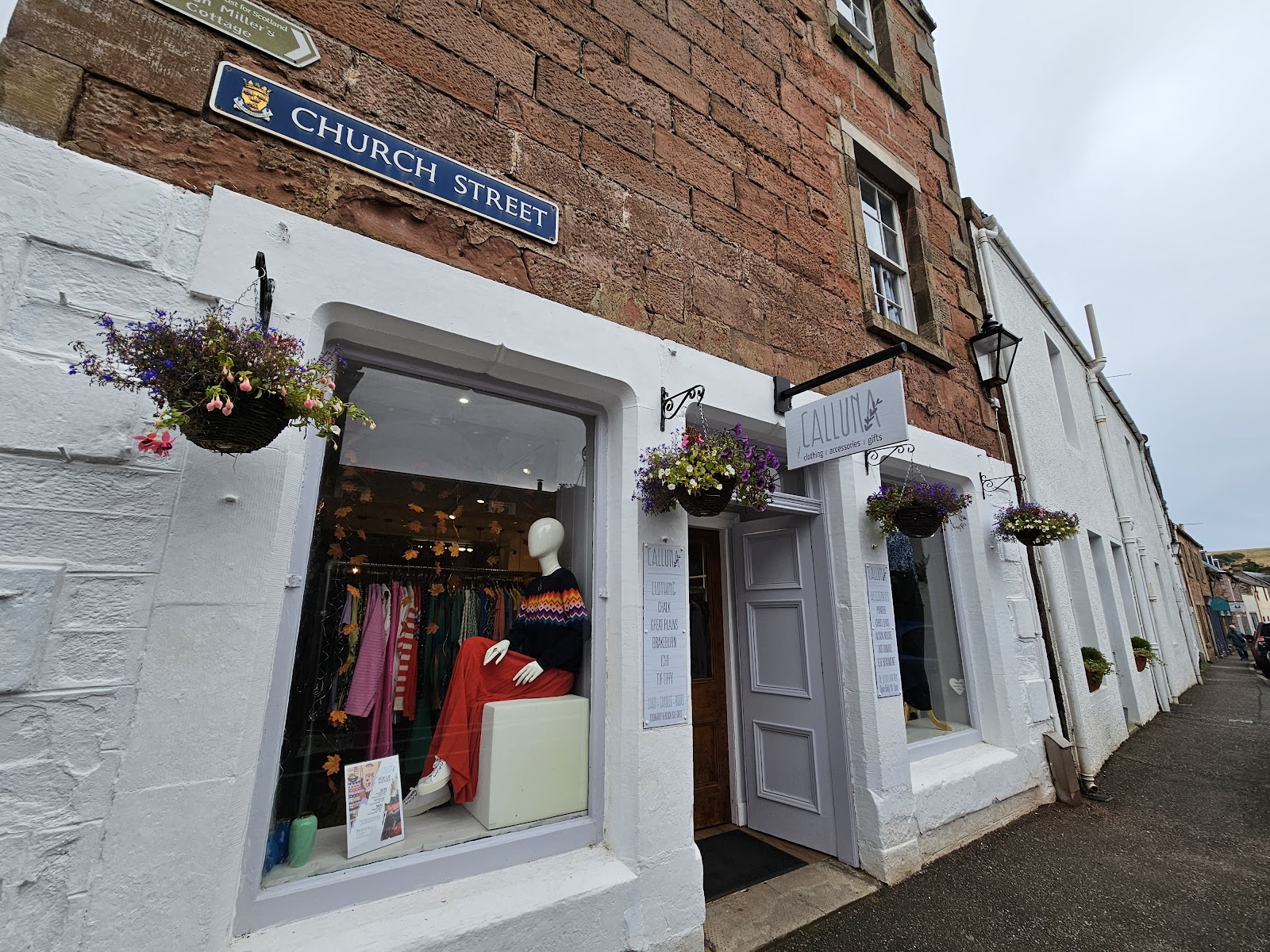 Calluna clothing shop with hanging baskets on Church Street