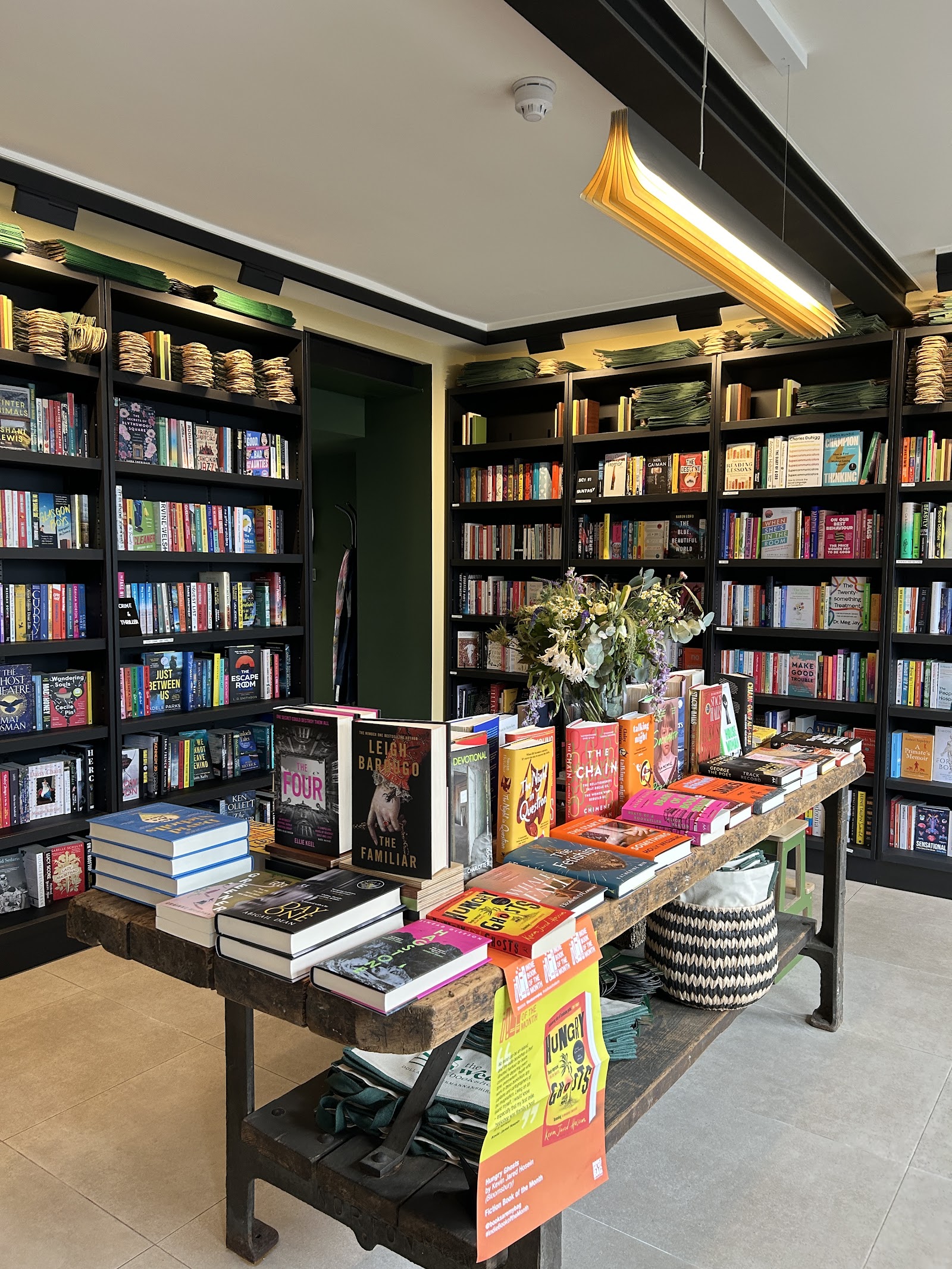 Bookshelves and a display table in the Wee Bookshop.