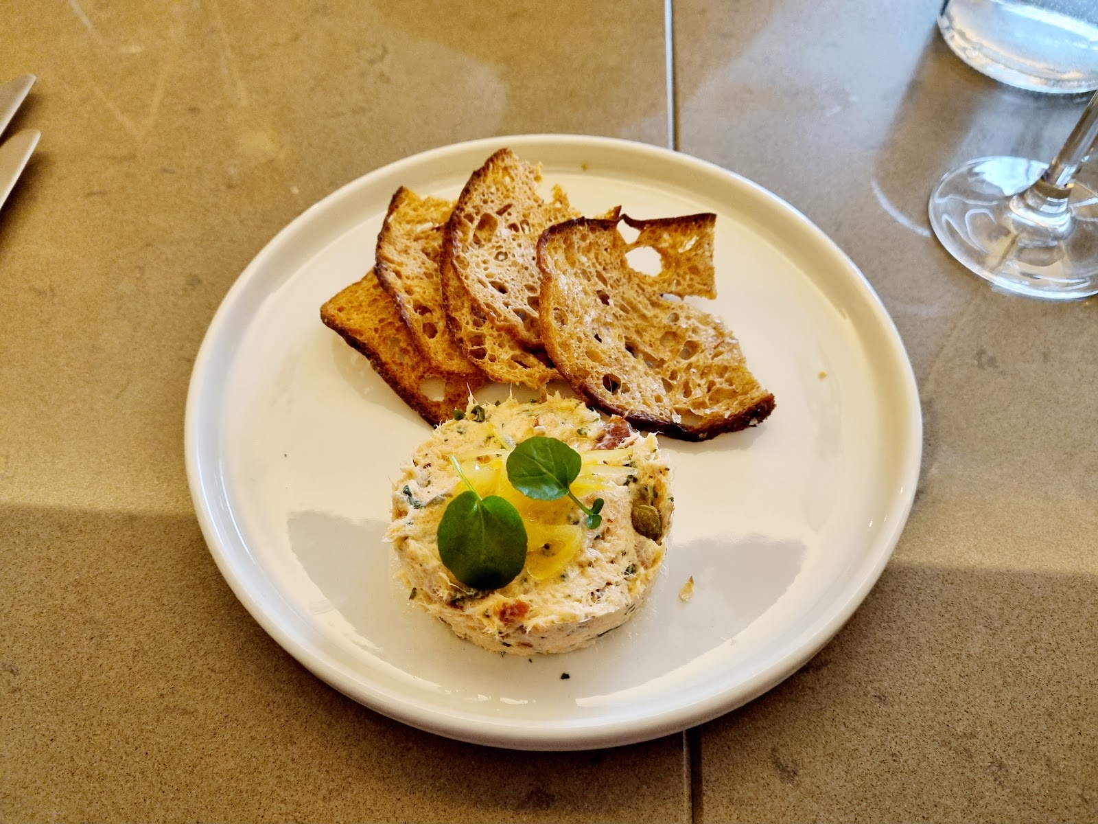 A plate of crispbreads and pâté at Angels with Bagpipes.