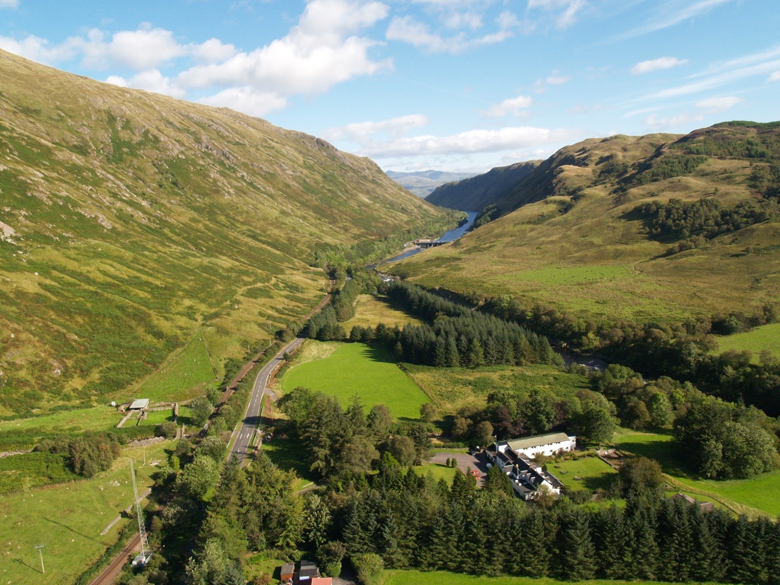 The Pass of Brander from above: the road, the railway and the River Awe between steep green hills.