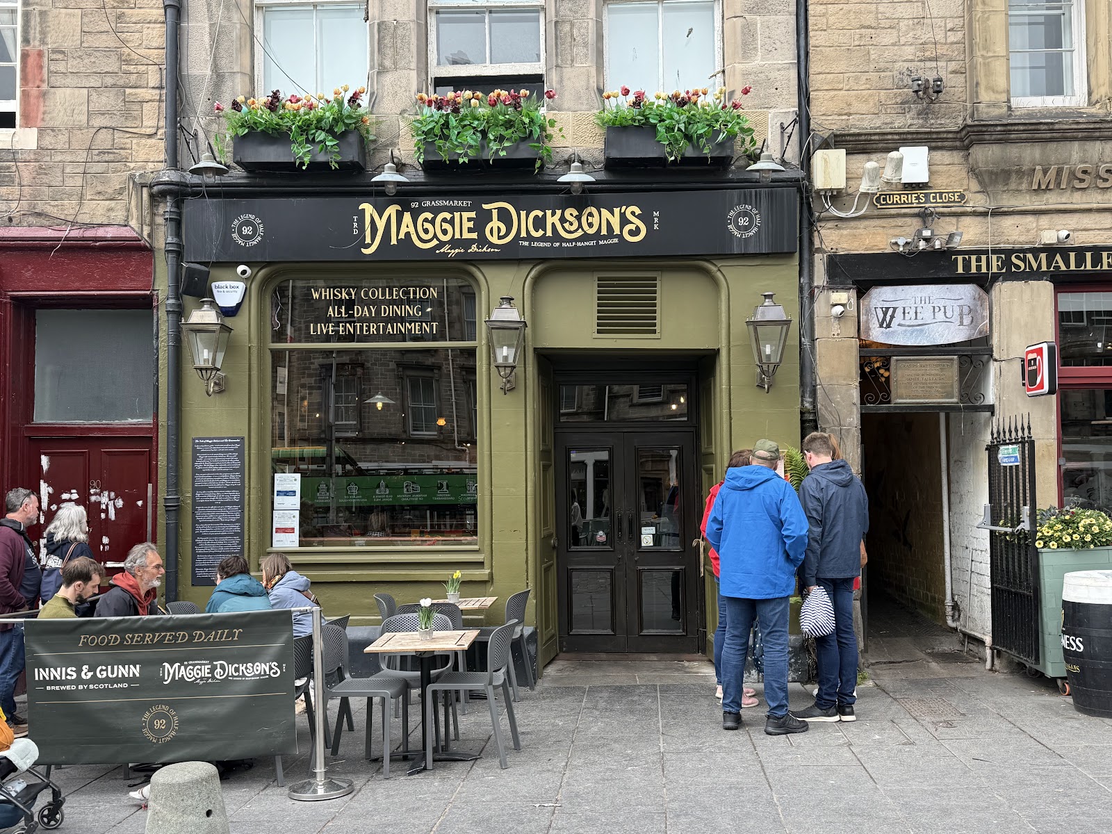 The green front of Maggie Dickson's on the Grassmarket, gold lettering over the door.
