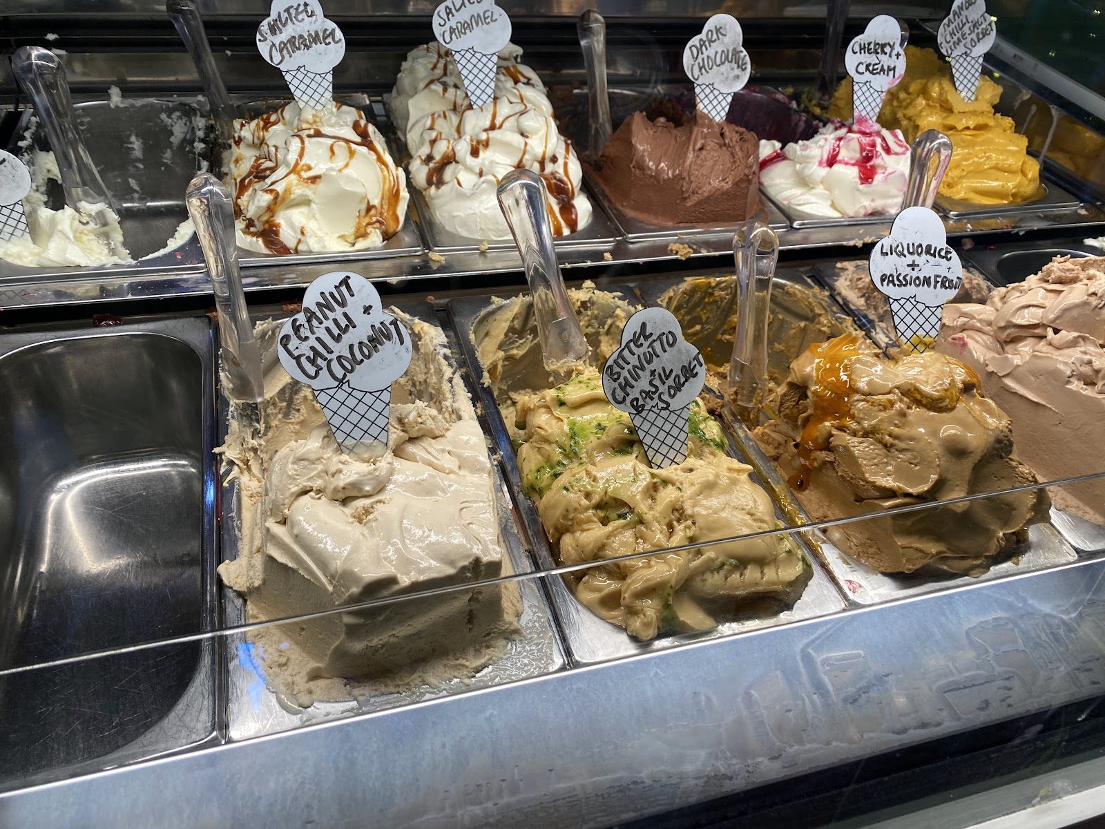 Gelato counter with flavours including peanut chilli coconut, bitter chinotto basil sorbet and liquorice passion fruit