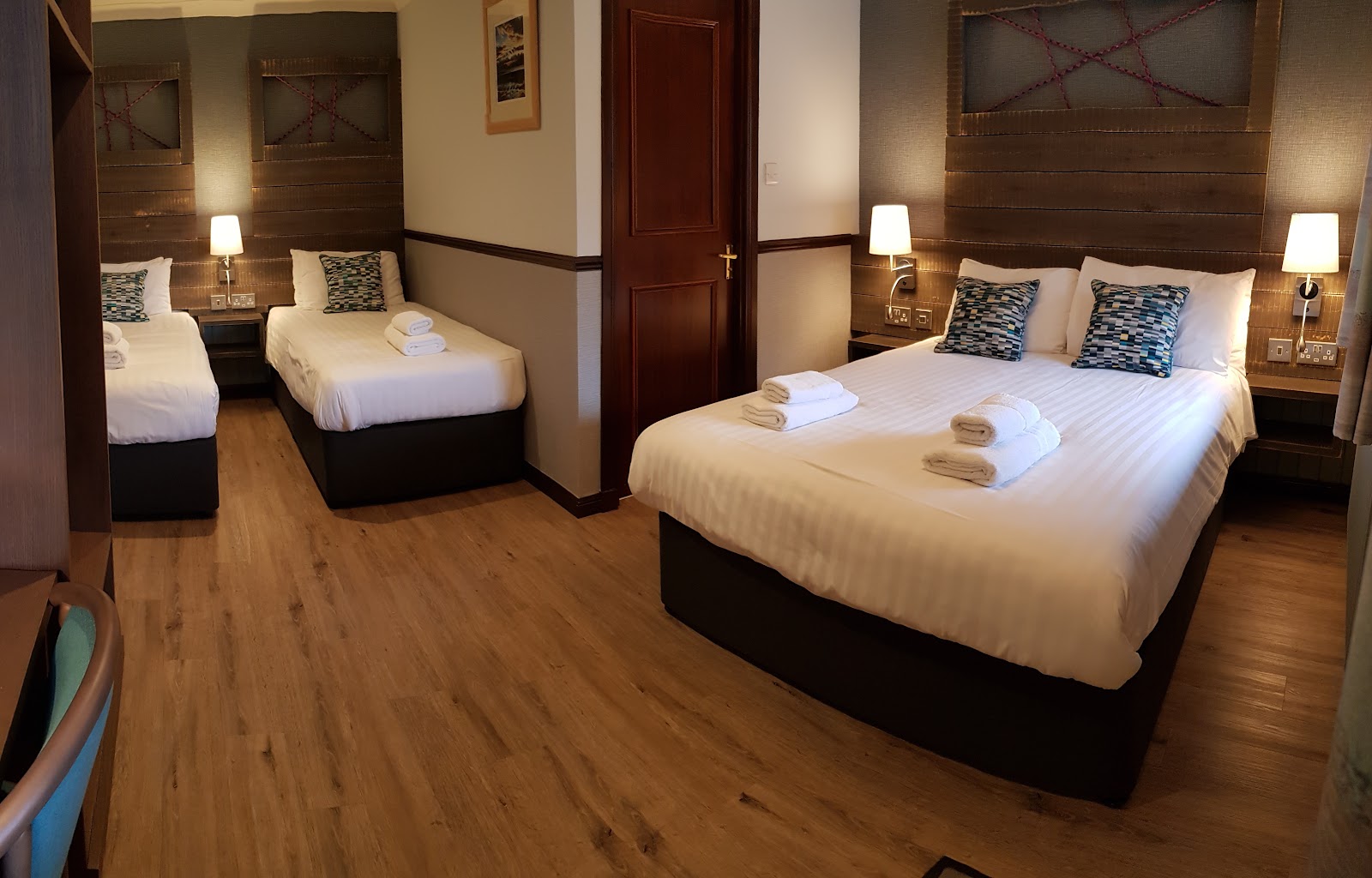 Hotel family room with a double bed and two single beds