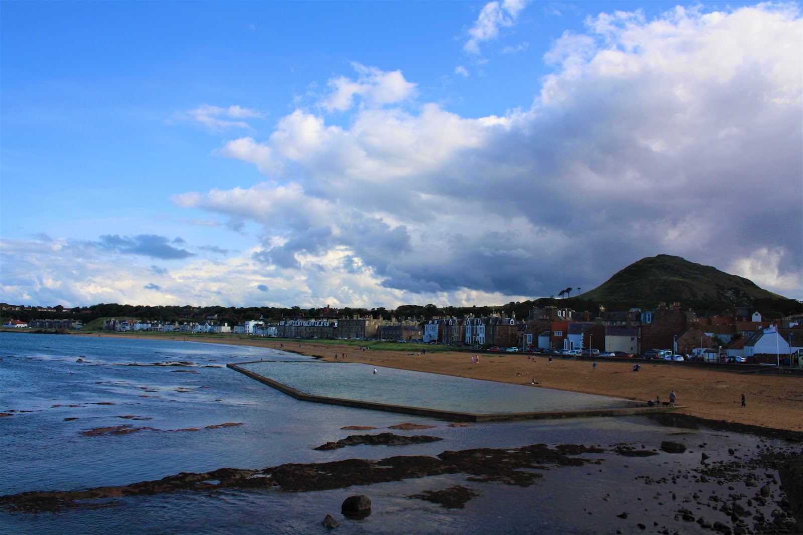 Milsey Bay at North Berwick, the boating pond in the rocks with the town and the Law behind.