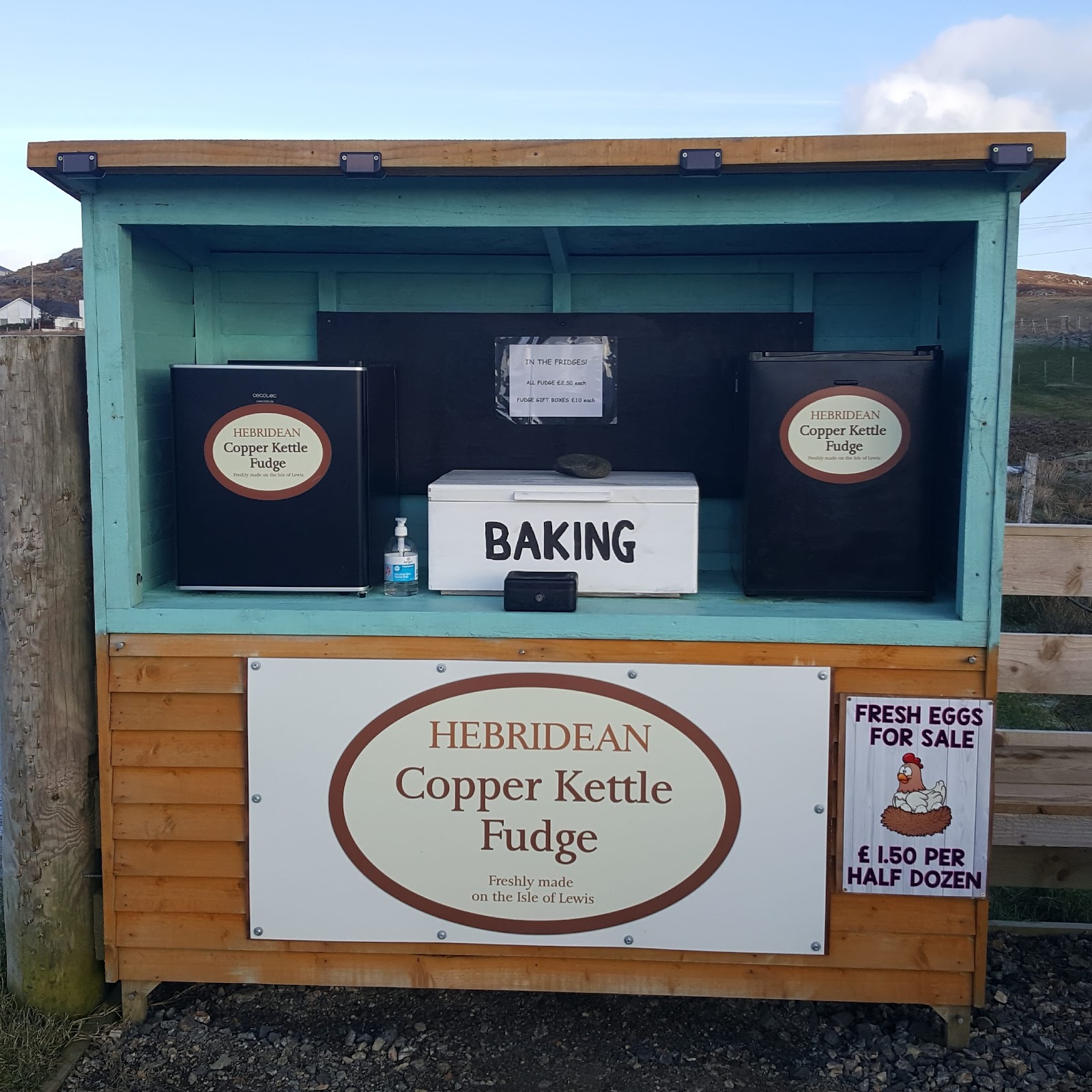 Roadside honesty stall selling Hebridean Copper Kettle Fudge, baking and fresh eggs, Isle of Lewis