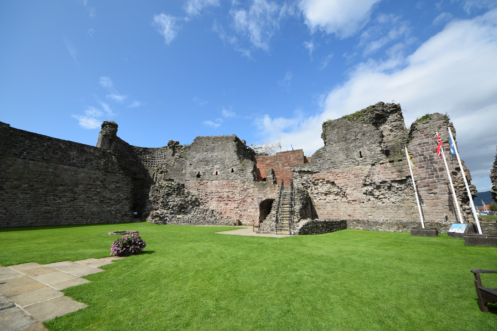 The castle walls reflected in the moat.