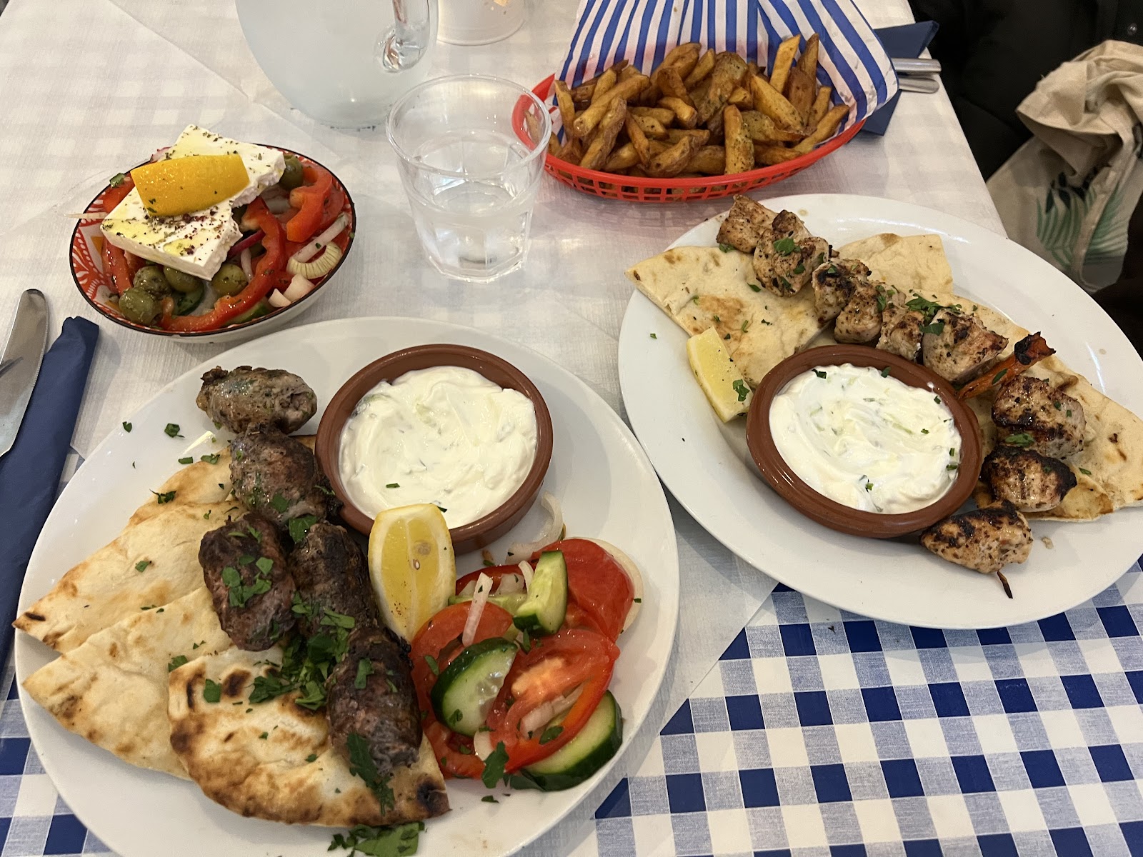 Grilled fish, souvlaki and pitta on blue gingham at Andreou's, Arbroath.