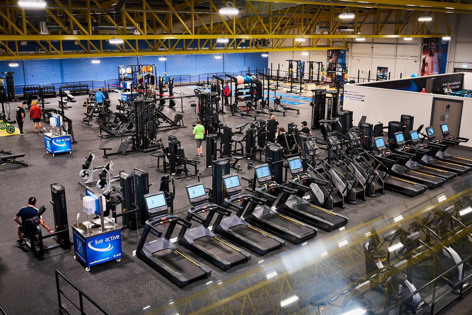 Rows of treadmills and weight machines fill the Live Active gym floor