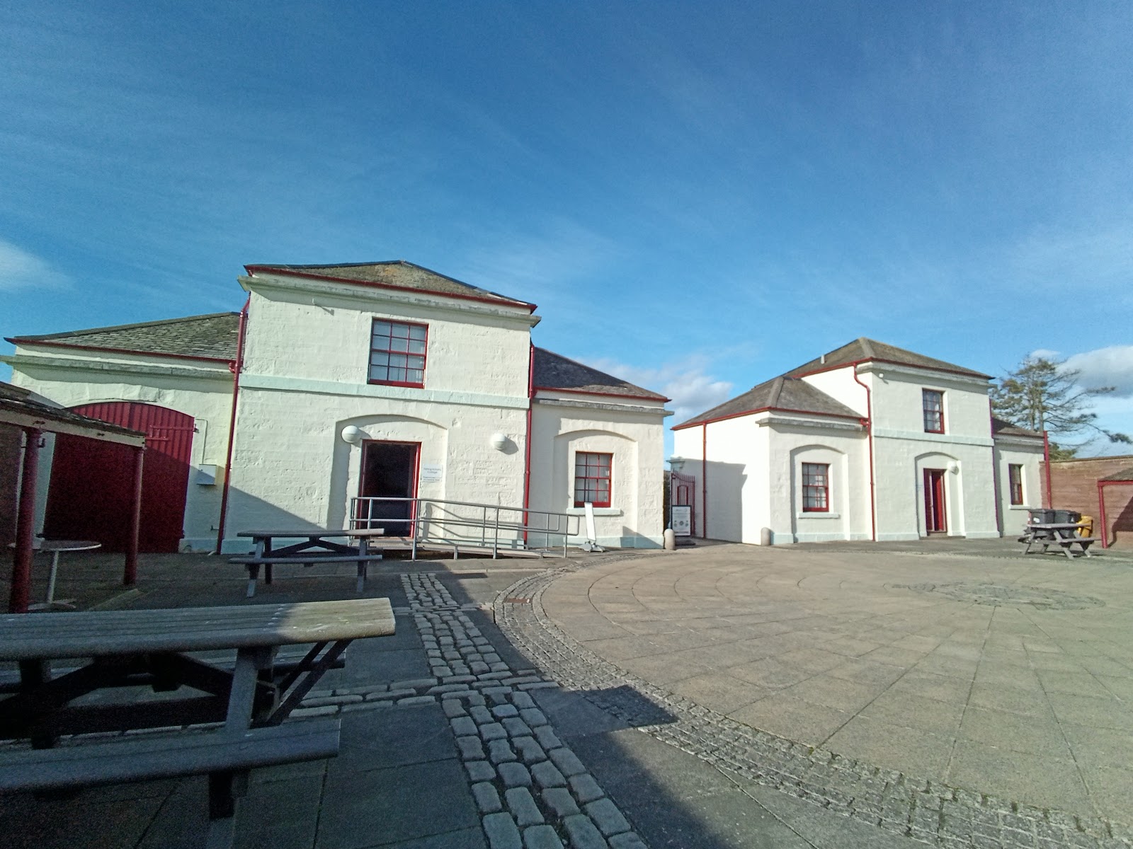 The white Signal Tower building and its courtyard by Arbroath harbour.