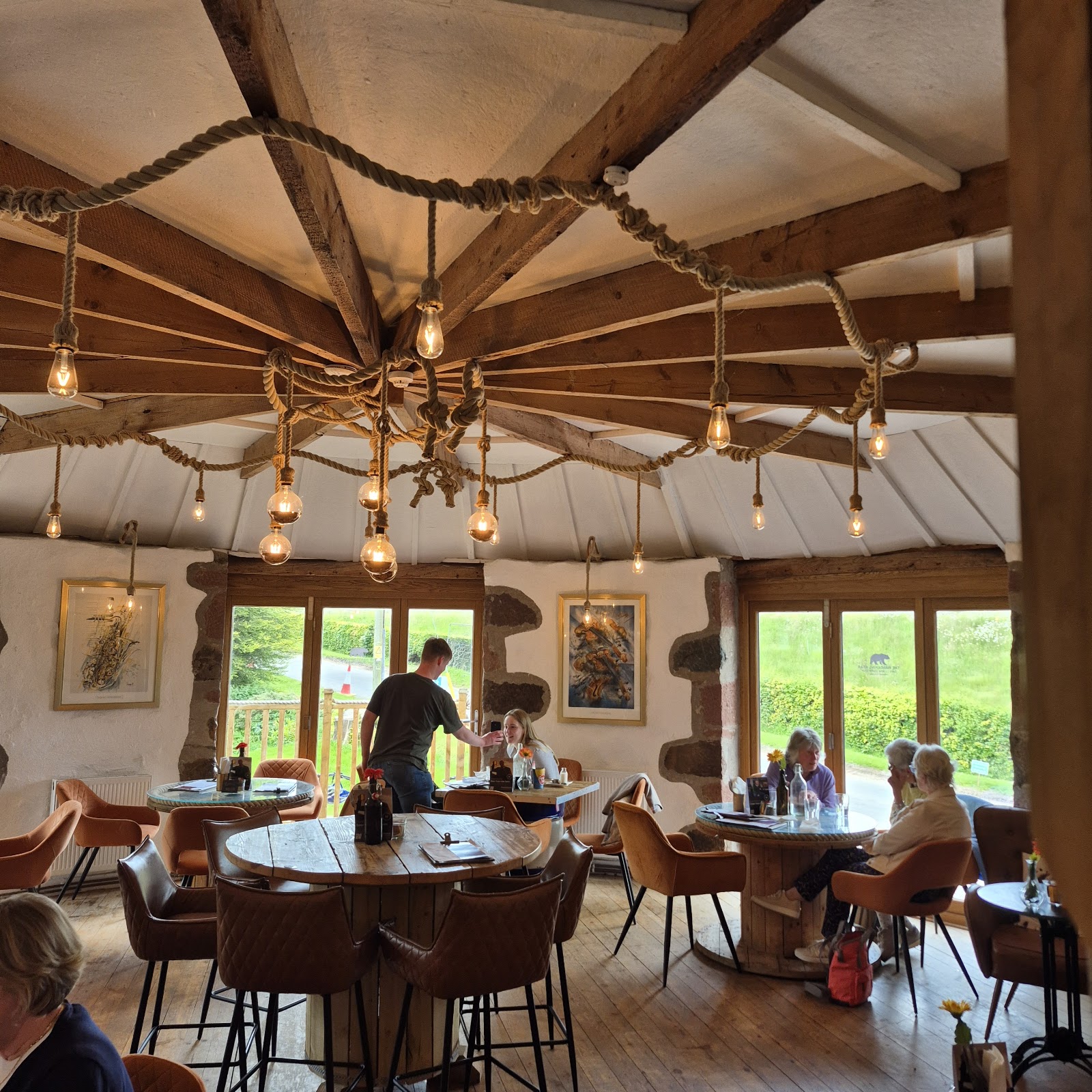 The round dining room of the Wandering Bear under its spoked timber roof.