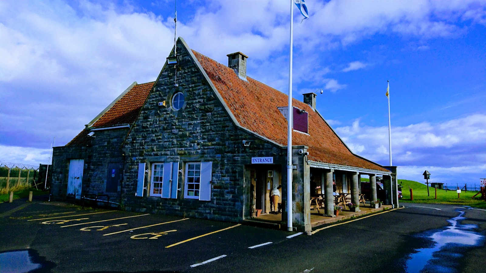The farmhouse that hides Scotland's Secret Bunker, a stone house with a red pantile roof and flags.