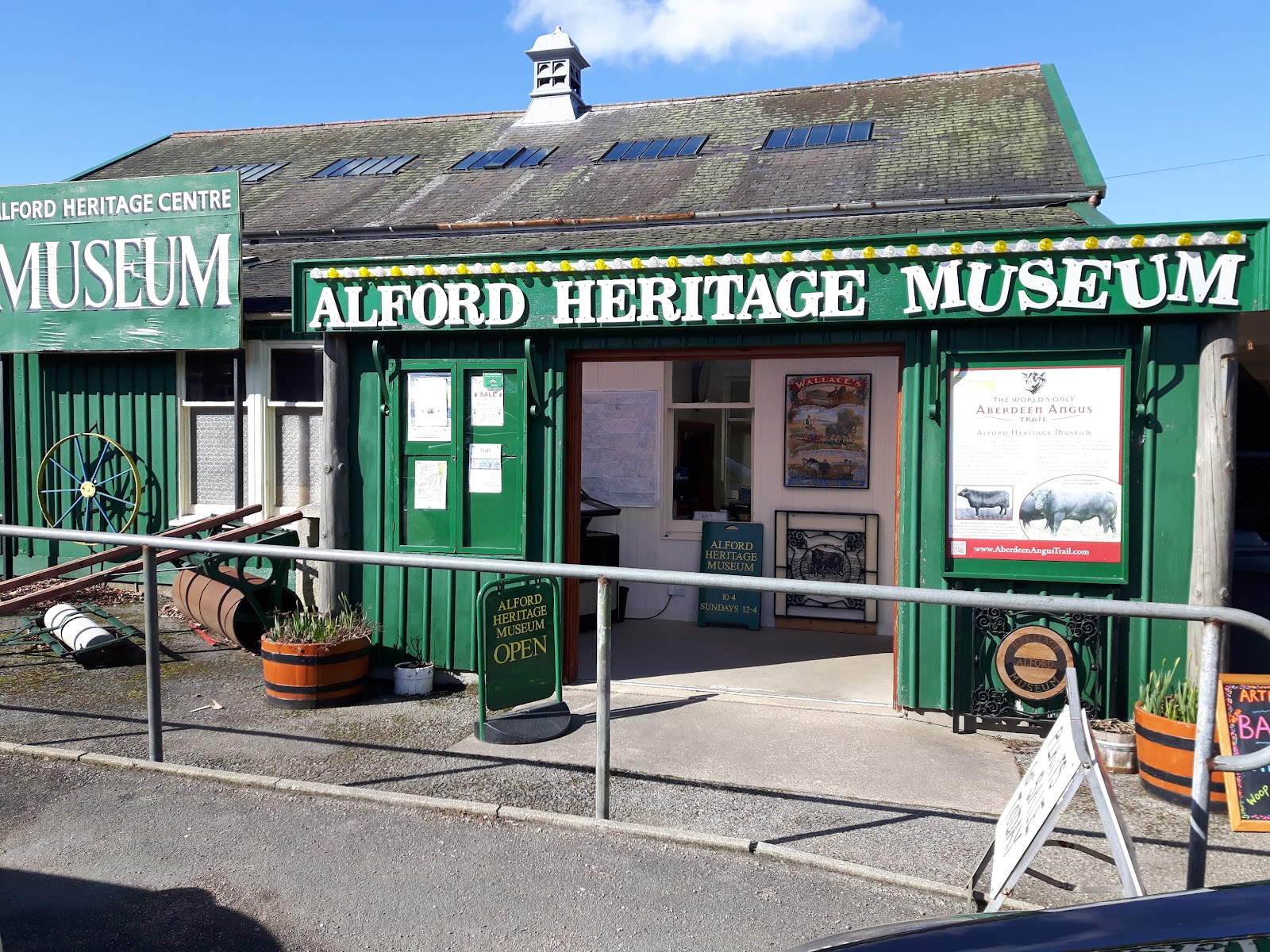 The green front of the Alford Heritage Museum under its painted sign, in the old auction mart.